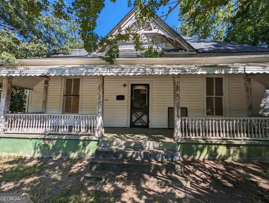Restoration is underway on this 5 bedroom and 3 bath downtown Barnesville home. Much has been done and there is much to do. Add your finishing touches and make it your own. Many restoration and remodel materials and fixtures are on site and just ready to install. There is a small barn in the backyard too. Bring your imagination and check out this beauty asap. This home will be sold "AS IS" and the sale is subject to approval of members of the LLC.