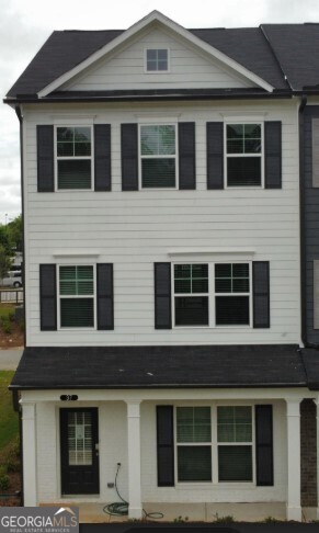 4.75% FIXED RATE FINANCING OR $20,000 ANY WAY YOU WANT IT! END UNIT with front porch!! The Eaves is a beautiful three-story floorplan that features 3 bedrooms, 3.5 baths, 42" white kitchen cabinets with under cabinet lighting, upgraded tile backsplash, Iced White quartz countertops, oversized island, and stainless steel appliances. The entire main floor is very open and spacious, and the family room includes a beautiful linear fireplace with floor to ceiling accent paint! Huge covered deck with privacy panels is perfect for entertaining or enjoying a quiet evening at home and listening to the rain. Luxury vinyl plank runs throughout the main living areas. Spacious owner's bath has separate water closet, and a large shower. 2" faux blinds are included, and a 2 car garage is attached!! This low maintenance home means more time for an active lifestyle which includes superb walkability to shopping and dining. And we are literally adjacent to the wonderful LINC Trail that runs throughout Newnan. Enjoy a fun game of pickleball with your neighbors before walking to dinner at one of the nearby restaurants. ASK US ABOUT OUR 100% FINANCING OPTION. Don't miss out on this exceptional value!! Seller $20,000 contribution is with Seller's preferred lender. This listing shows photos of the model home which is the same floorplan.