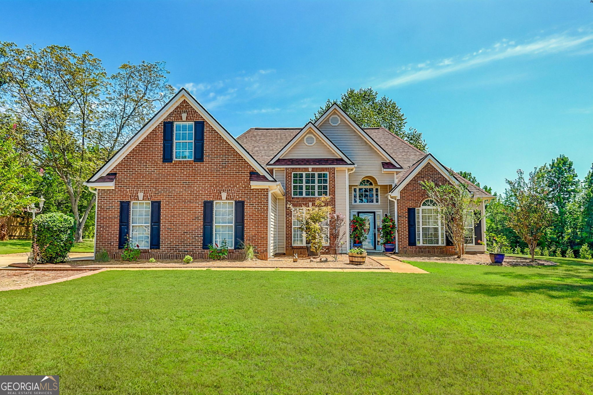Dreamy Brick Ranch on 1.5 Acres with Private Pool Oasis - Welcome to your private retreat-this beautifully updated brick ranch sits on 1.5 serene acres and offers the perfect blend of charm, comfort, and modern upgrades. Featuring 4 spacious bedrooms and 3 full baths, including a luxurious main-level owner's suite with sitting room, trey ceilings, and spa-like bath, this home is designed for easy living and elegant entertaining. Step inside to find vaulted ceilings, rich hardwood floors, and an inviting open layout that flows from the formal dining room to the cozy family room with fireplace and into the bright, eat-in kitchen-complete with granite countertops, and stainless appliances. The true showstopper...a fully fenced, resort-style backyard-a dream come true for both relaxation and entertaining. Lounge under the covered porch, host unforgettable evenings in the charming gazebo, or take a dip in the sparkling in-ground pool, surrounded by lush new landscaping and wide-open green space. It's your own private paradise. Upstairs offers a private bonus suite with a full bath-ideal for guests, a teen suite, or home office. Additional upgrades include: New roof & AC (2025), new garage door & opener (2024), new lighting, custom closet, updated shower, and more. Don't miss this rare gem-peaceful country living just minutes from the shops, dining, and charm of historic downtown Senoia!