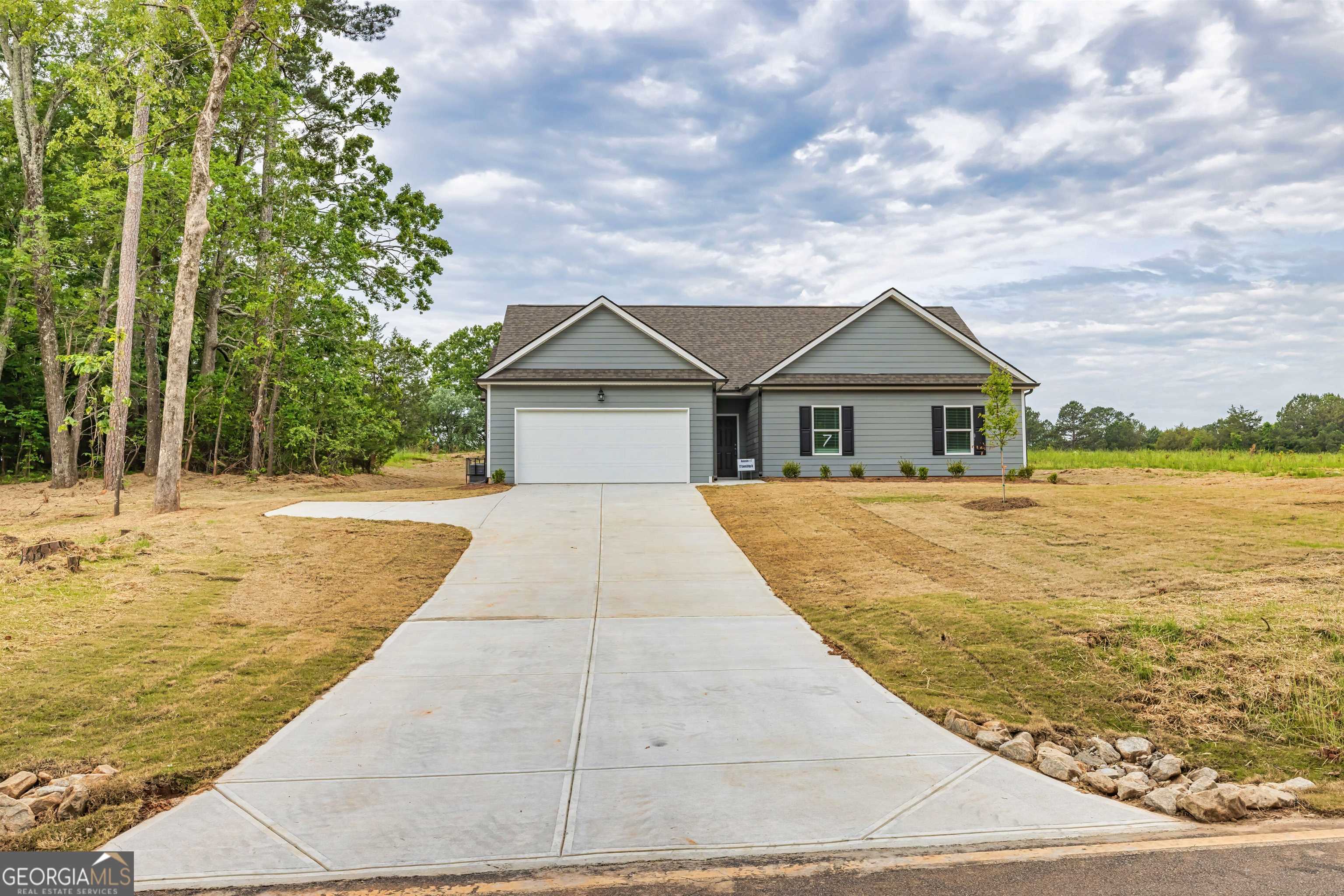 Wow, new ranch home being built now! This 4 bedroom/2 bath new home with covered back porch overlooking a private yard won't stay on the market very long! Completion Date: Late Sept/Oct. The WILLOW plan is a 1-story home with 1,643 heated sf, plus a 2-car garage. The kitchen has granite countertops, pantry, dining area, and appliance package includes stainless steel dishwasher, range and microwave range hood. The main level owners suite has a tray ceiling and features double sinks, garden tub, separate shower and a walk in closet. This is a split bedroom plan with the other 3 bedrooms on the main on the opposite of the home from the owner's suite. All 3 secondary bedrooms have walk-in closets. The vaulted great room is in the center of the home. Bathrooms have full height elongated toilets, cultured marble counter tops and chrome finish plumbing fixtures. Brushed nickel lighting fixtures. 2" faux wood blinds. Flooring includes: carpet (bedrooms), luxury vinyl plank and vinyl (bathrooms and laundry). Exterior siding is Color Plus Hardie Board (15 year paint warranty) with architectural shingle roof. Total Electric. USDA area. City of Jackson power/water utilities. Builder contributes $5,000 toward buyer closings costs when using a preferred loan officer, and an additional $1,000-$3,000 lender credit may come from a preferred loan officer should buyer qualify. Contact Amy today to find out more about our new homes in Valley Place! Built by: Carlton Communities LLC.