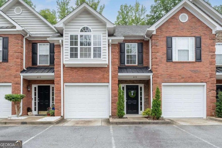 Just minutes from the vibrant heart of Downtown Woodstock and a short drive to Historic Roswell, this impeccably styled townhome is nestled within an exclusive community of just 13 residences, offering a rare blend of luxury, privacy, and convenience. From the moment you step inside, you're welcomed by a bright, open layout featuring rich luxury vinyl flooring, fresh alabaster paint with crisp white trim, and thoughtfully curated designer finishes throughout. The chef-inspired kitchen is a true showstopper, boasting gleaming granite countertops, a deep breakfast bar that feels like an island, stainless steel appliances, a large pantry, and a charming arched entry into the spacious living and dining areas. Step outside to a tranquil, fenced backyard with a spacious patio and privacy screens-perfect for entertaining or unwinding. Upstairs, two expansive bedrooms await, including a stunning primary suite with abundant natural light and a beautifully updated en-suite bath featuring a sleek walk-in shower with frameless glass doors, elegant tile, and granite counters. This beautifully appointed home offers refined living in a prime location-don't miss the opportunity to make it yours.