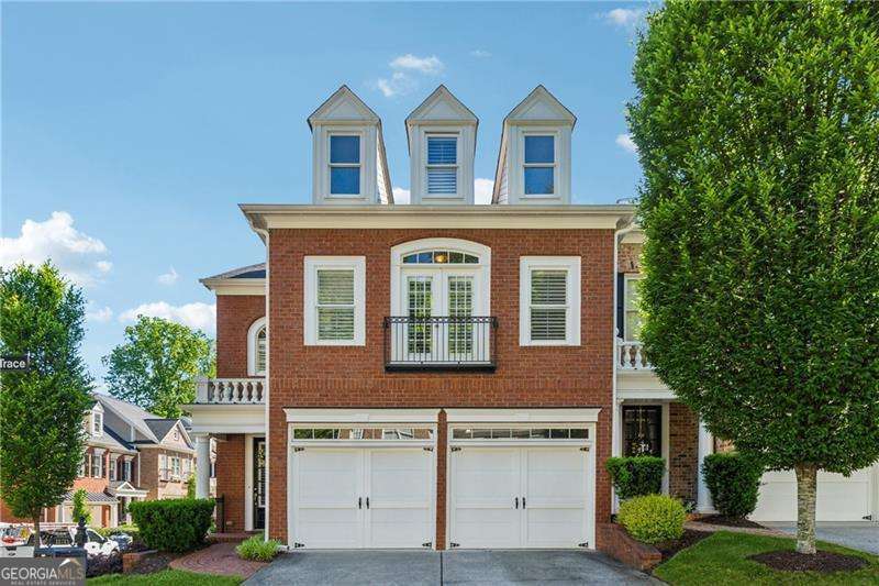 Beautiful End Unit in Academy Park with Private Fenced Courtyard. Amazing RENTAL POTENTIAL as well for an Investment Property! Enjoy tons of natural light with 3 sides of windows accented by Plantation Shutters throughout! The main level boasts true hardwoods which start with an elegant foyer and flow into a dining room that can easily accommodate a large gathering. The living room has a gas fireplace which is next to the breakfast area and spacious kitchen with tons of storage space and Craftsman style cabinetry. Out the back is an expansive private courtyard that is perfect for entertaining, gardening, pets, or just enjoying the sun. On the second floor you'll enjoy a luxurious primary suite with vaulted ceilings, bathroom with a spa bath whirlpool tub, dual vanities, walk in shower, and 2 walk in closets. Down the hall is an office nook, additional storage, laundry room and 2 guest bedrooms that share a Jack n Jill full bathroom. The 3rd floor offers endless potential as a flex space, home gym, office or additional bedroom as the large walk in closet can be converted to a full bathroom as well. The property was in the middle of redoing flooring and now allows the buyers to come and pick their own options throughout! You'll also enjoy 2 car garage with high ceilings for additional storage if needed. Conveniently located right near the amenities, ample guest parking, and nature trail entrance for the Alpha Loop access. Enjoy the amenities with lighted tennis/pickleball courts, Jr. Olympic swimming pool, clubhouse, fitness center & onsite management. The community has direct access to the Alpha Loop with resident gates opening right to Avalon on one side and Downtown Alpharetta on the other! Enjoy all the festivals, farmers market, restaurants and shops just minutes from your door!