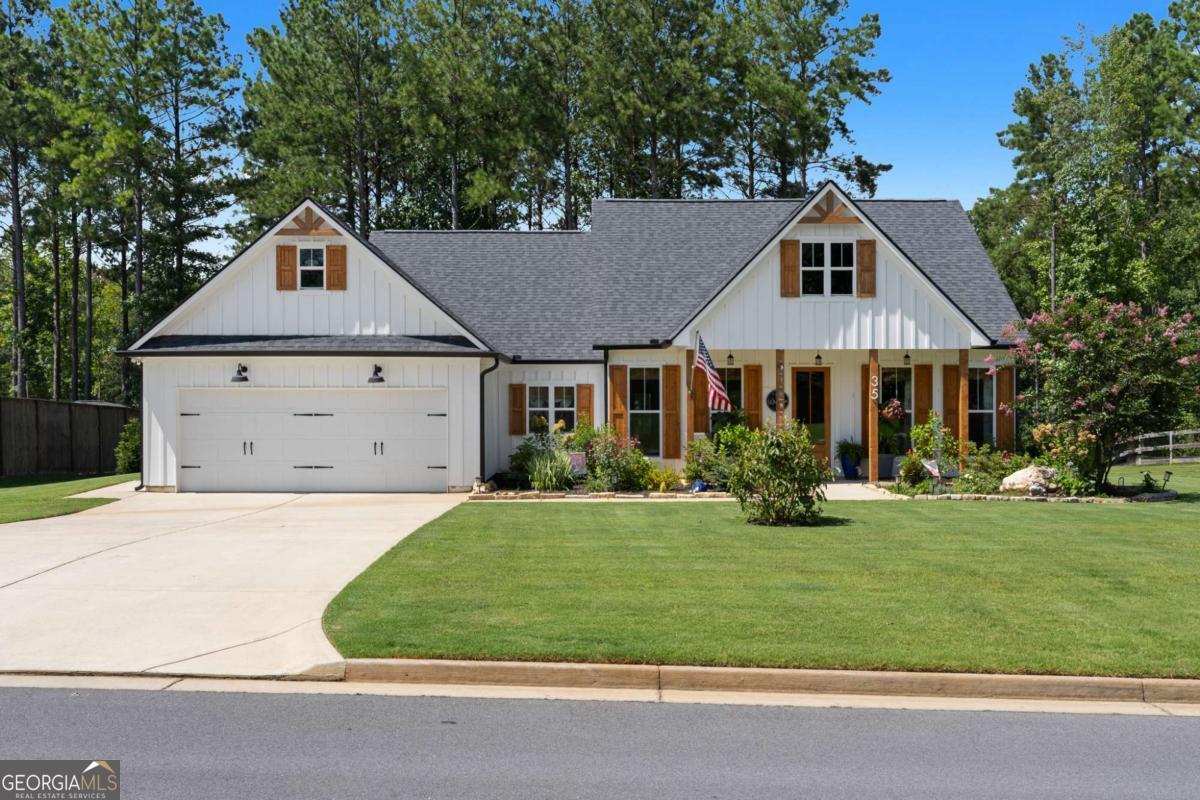 Discover this beautiful ranch home situated in Rock Mountain, Georgia! This charming residence features three bedrooms and two bathrooms, perfect for comfort, practicality, relaxation and entertaining. Step into the gourmet kitchen, which boasts an oversized island, a farmhouse sink, and an upgraded pantry, making it a chef's delight. A window over the kitchen sink fills the space with natural light, while the adjacent living area features a cozy fireplace and built-in bookshelves, ideal for displaying your favorite reads and decor. Custom window treatments add a finishing touch of elegance throughout the home. The owner's suite serves as a true retreat, complete with a spacious closet and an extended shower for a luxurious bathing experience. Outside, you'll find a beautifully landscaped yard filled with matured blooms, creating a serene setting. The property also includes a shed for additional storage, all set huge lot providing plenty of space to create your own personal oasis on our extended oversized deck. Don't miss your chance to make this stunning home your own!