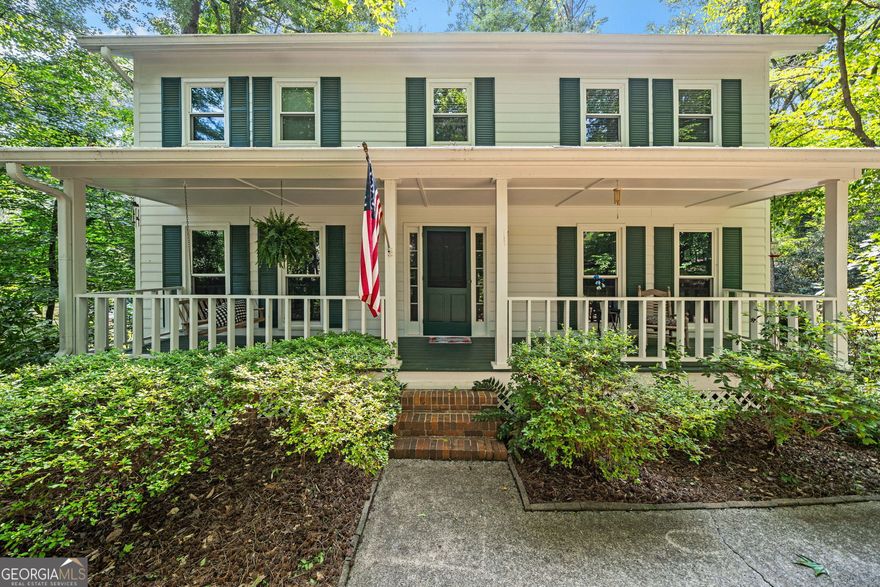 Welcome Home! Discover a rare gem nestled on a private lot, park-like grounds with a picturesque lake views. This 4-bedroom, 2.5-bath residence offers unparalleled tranquility, surrounded by mature hardwoods and flower gardens. The traditional floor plan features a large eat-in kitchen with a beautiful view of the backyard. The large living room with wood burning fireplace is perfect for parties or gatherings. The main floor boasts a formal dinning room, large living room, kitchen, half bathroom, and laundry room. Outside, enjoy total privacy on your lush backyard deck, perfect for entertaining, or relax on the front porch. With a large two-car garage and unfinished basement area. This home is in close proximity to shopping, and a short drive to ATL airport, this beautiful lake community home is just waiting for you to call it your own!