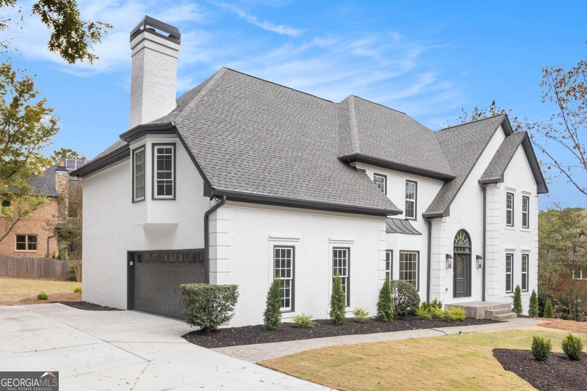 Completely Reimagined Family Luxury in Prime North Atlanta Suburbs. Discover a completely renovated sanctuary at 2820 Harwick Drive, a perfect setting for your family's luxurious life in the Northern suburbs of Atlanta. Nestled within the desirable Spalding Green community, this home has been meticulously transformed, blending its generous 5,383 sq. ft. footprint with contemporary, high-end finishes. The dramatic foyer welcomes you with a gorgeous new chandelier. Designed for the modern family, the spacious layout with completely NEW hardwood flooring on the main floor features a private guest room with an ensuite bathroom, an open concept living area with a grand fireplace designed with floor-to-ceiling premium stone, sky-high ceilings and open sight-lines, and a gourmet kitchen with brand new top-of-the-line appliances, a double oven, new cabinets, and new stone countertops featuring a waterfall island, ideal for both everyday connection and large-scale entertaining. The gourmet kitchen flows seamlessly into the sun-drenched breakfast area that leads to the renovated deck for an outdoor extension of the home. The completely finished, daylight basement with luxury vinyl flooring provides flexible uses including a children's play area, home office, home gym, or media center. The basement even has a bar for entertaining guests and a full bath with a steam room. Functionality meets elegance with 6 bedrooms and 5 full bathrooms, including a large stunning Primary Bedroom Suite with an attached sitting room and fireplace connecting to the primary bathroom with New custom his-and-her closets, and three additional oversized bedrooms upstairs, each with a private, renovated en-suite bath. Enjoy the benefits of a new home within an established neighborhood. A brand new HVAC system services the basement, and each floor operates on its own dedicated unit. The roof is only two years old. New flooring, fresh paint, a new kitchen, new custom bathrooms each with their own unique look, new electrical and plumbing fixtures throughout, and new landscaping with exterior painting for maximum curb appeal. The BRAND NEW brush finished driveway gives this home the cleanest look in the neighborhood. This location offers unmatched convenience and a vibrant lifestyle. You are just minutes from top-tier schools (Dunwoody Springs, Sandy Springs, North Springs), convenient shopping destinations (Publix, Kroger, Target), and quick access to GA-400 and I-285. This turnkey property provides a peaceful, private environment while keeping you central to everything the northern Atlanta suburbs have to offer. Don't miss your chance to own one of Spalding Green's finest-schedule your private showing today.