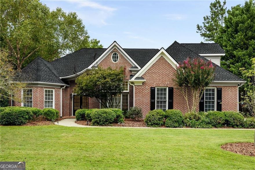 Giving you exclusive access to this exceptional East Cobb executive residence! nestled on a peaceful cul-de-sac and offering breathtaking sunset views. Step through grand double doors into a dramatic great room with soaring ceilings, complemented by a formal dining area accented with elegant wainscoting. Just off the foyer, a distinctive turret-style office with French doors makes the perfect private workspace.  Designed for easy main-level living, this home includes everything you need on one floor-except for a spacious upstairs bonus suite, complete with its own full bath. The expansive primary suite features a luxurious bathroom with a jetted soaking tub, separate shower, private water closet, and an oversized walk-in closet that feels like its own wing.  A thoughtfully designed split-bedroom layout ensures privacy, with two secondary bedrooms sharing a Jack and Jill bath and featuring custom built-in shelving and storage. The gourmet kitchen is ideal for any home chef, offering a breakfast bar, casual dining space, and open views into a sunroom or cozy keeping room. Direct access to the stepless garage leads to a functional laundry/mudroom and a convenient half bath just off the hallway. Step outside to a beautifully manicured backyard with a charming pergola-covered patio, perfect for outdoor entertaining or relaxing evenings. Recent updates include a brand-new roof, fresh interior and exterior paint, a new water heater, and a new garbage disposal. Every inch of the home including carpets, windows, and screens-has been professionally cleaned. Move-in ready! schedule your tour today!