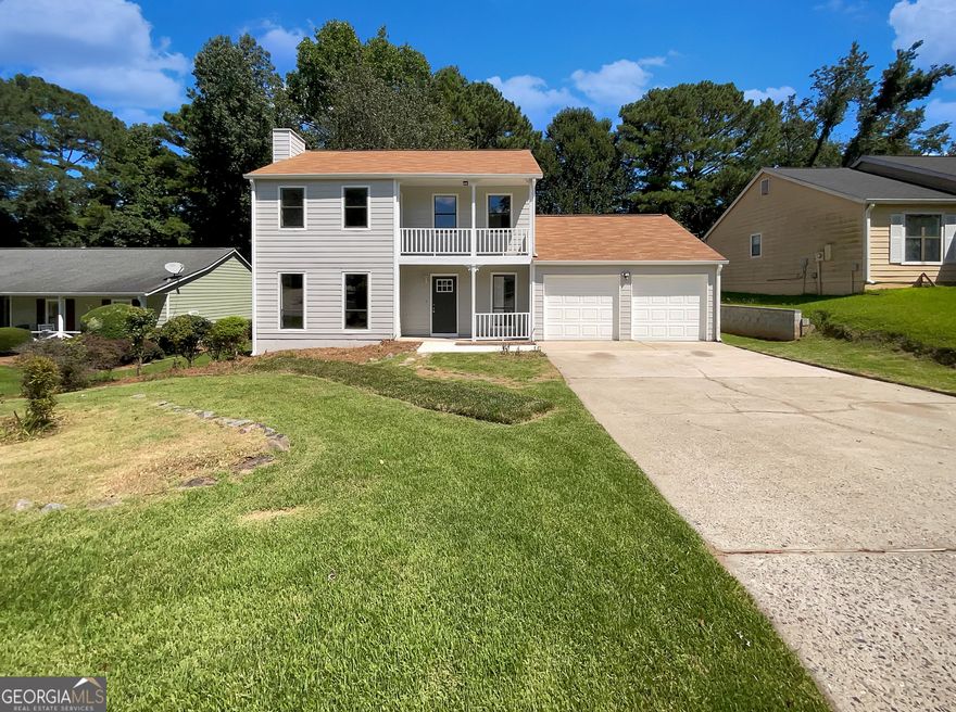 Welcome to this beautifully updated home in the heart of Alpharetta! Just off the entrance, you'll find a convenient half bath. The bright white kitchen opens with a sliding door to a brand-new deck, perfect for outdoor dining and entertaining. Adjacent to the kitchen are the laundry room, double garage, and an extra storage area for added convenience. A separate dining room and a spacious living room with a cozy stone fireplace complete the main level.  Upstairs, the home offers three bedrooms and two full baths, including a lovely owner's suite with a private walk-out front porch. Enjoy a peaceful backyard retreat ideal for relaxing or gathering with friends. With thoughtful updates throughout, this home blends modern comfort with charm-all in a sought-after Alpharetta location.