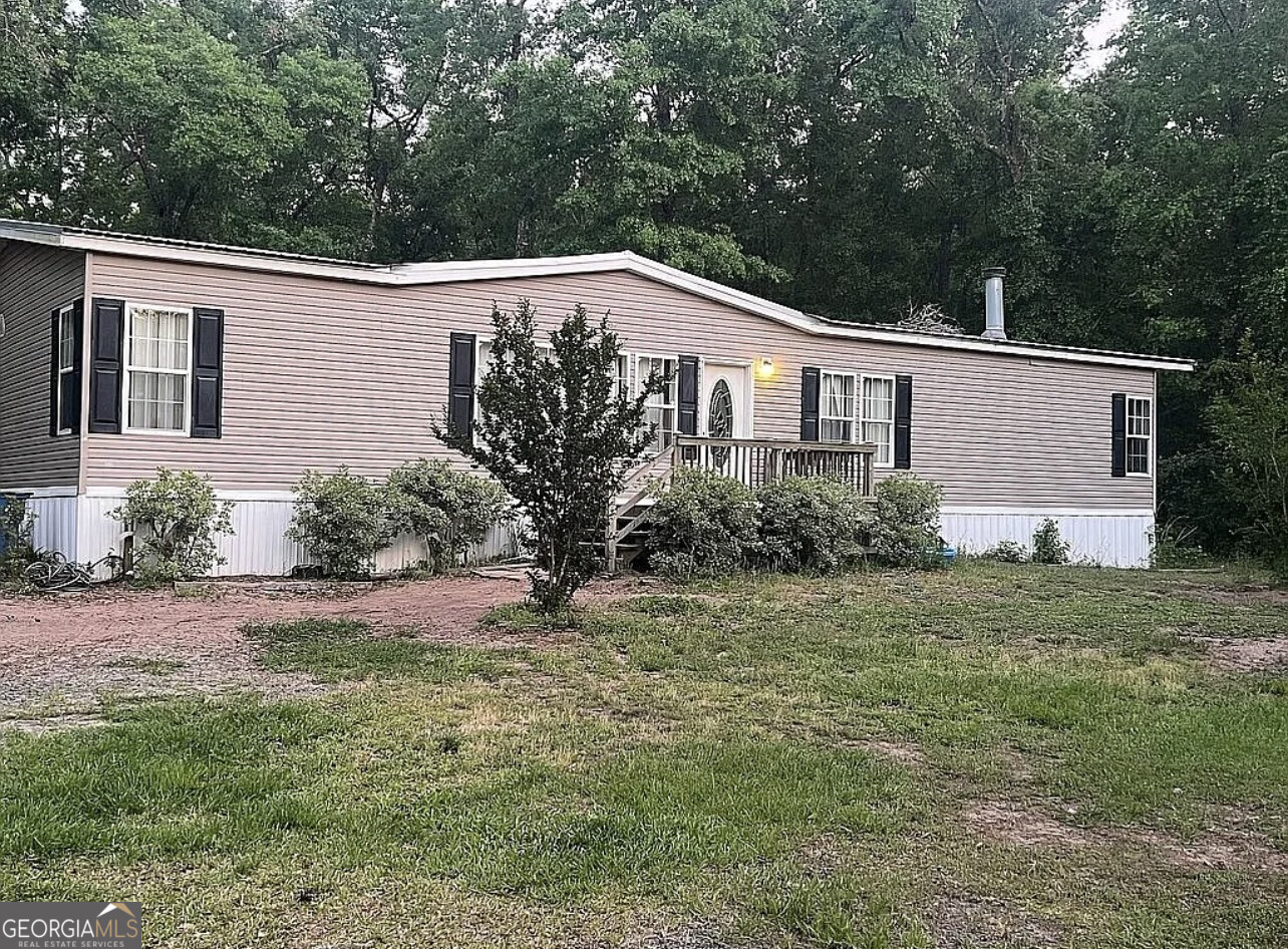 Discover the potential of this spacious property located in the peaceful setting of Brunswick, Georgia. Offering a blend of privacy and accessibility, this home sits in a quiet area with convenient access to local amenities, schools, and major roadways. Whether you're looking for a primary residence, an investment opportunity, or a property to customize to your taste, this address provides the flexibility you've been searching for. With ample outdoor space, mature surroundings, and the charm of country living just minutes from town, this property is ideal for those who value both comfort and convenience. Don't miss your chance to secure a property in a growing community that continues to attract buyers seeking affordability and opportunity. Schedule your showing today and imagine the possibilities at 865 Buck Swamp Rd.