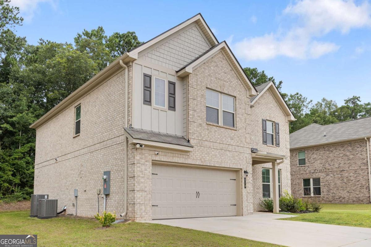 Welcome to 116 Cabin Way, an exquisite 4-bedroom, 3.5-bath residence built in 2023 that offers the perfect combination of elegance, comfort, and functionality. With its like-new construction, this home showcases thoughtful design and upscale finishes throughout. The inviting open-concept floor plan is anchored by gorgeous flooring and an abundance of natural light. A formal dining room, accented with a timeless coffered ceiling, sets the stage for elegant dinners and special gatherings. At the heart of the home is the chef's kitchen, boasting quartz countertops, premium stainless steel appliances, custom cabinetry, and a spacious eat-in breakfast area that flows seamlessly into the living space-ideal for both entertaining and everyday enjoyment. The primary suite serves as a private sanctuary, featuring a spa-inspired en suite with double vanities, a soaking tub, a separate shower, and an expansive walk-in closet. Equally impressive are the additional bedrooms, each designed with generous proportions, abundant closet space, and access to beautifully appointed bathrooms. These versatile rooms can serve as luxurious guest retreats, comfortable family bedrooms, or flexible spaces for a home office, playroom, or media lounge, ensuring the home adapts to your lifestyle needs. Additional highlights include a stylish mud room, a conveniently placed powder room, and a spacious 2-car garage that provides ample storage. Every detail has been considered to deliver both beauty and practicality. Set within a desirable community, residents of 116 Cabin Way enjoy close proximity to excellent schools, boutique shopping, fine dining, parks, and recreational amenities, making this home not only a residence but a lifestyle experience. Modern luxury, timeless craftsmanship, and everyday comfort come together seamlessly in this exceptional property.