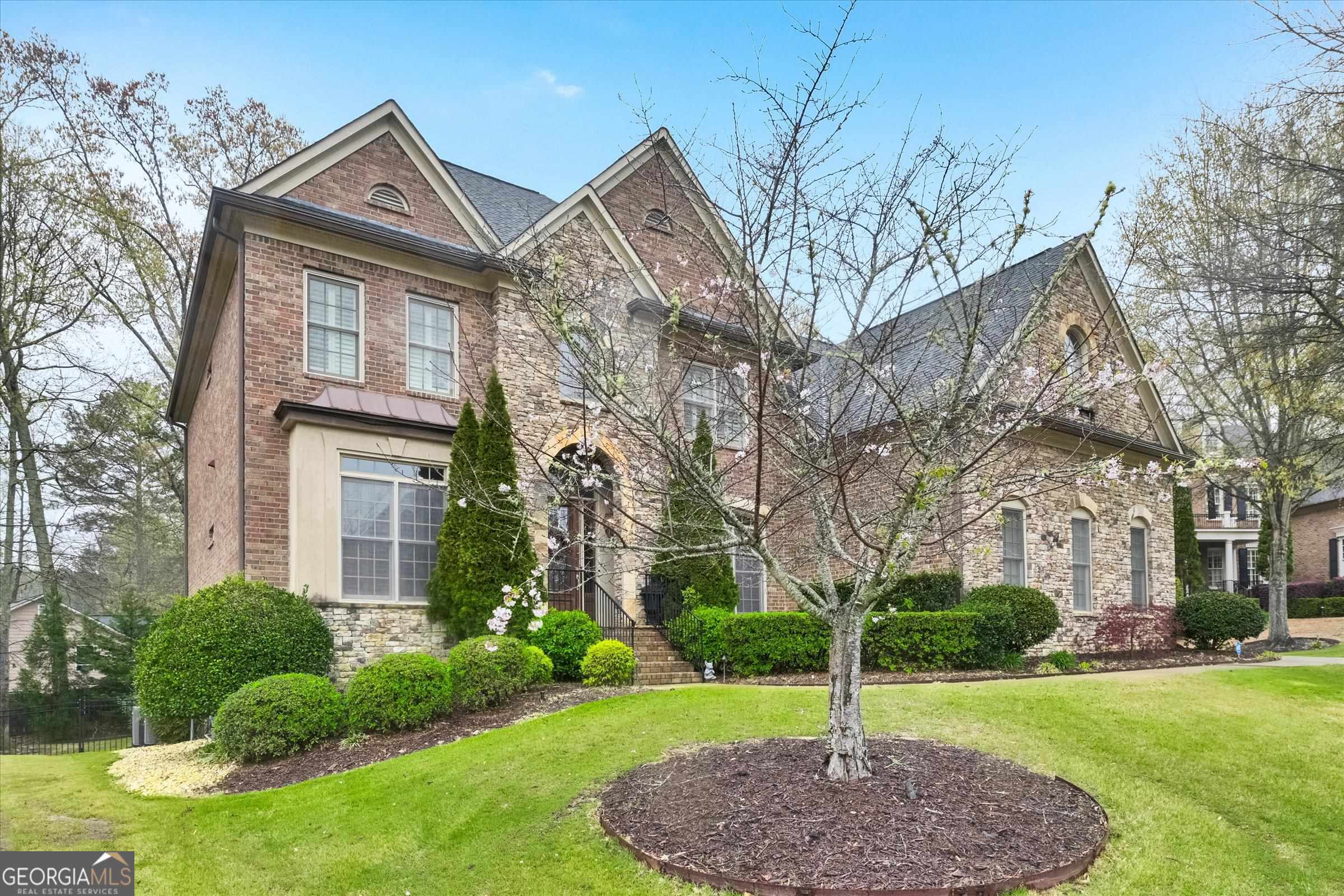 McIntosh School district! Beautifully designed and well appointed in Centennial's The Manor, you needn't look any further.      This stone and brick beauty features 6 spacious bedrooms (primary bedroom upstairs) including a guest suite on the main level, 5 full baths, finished basement with a deluxe theater room and a "to die for" pool and jacuzzi in the back yard. Make your move before summer and enjoy all this golf cart community has to offer.