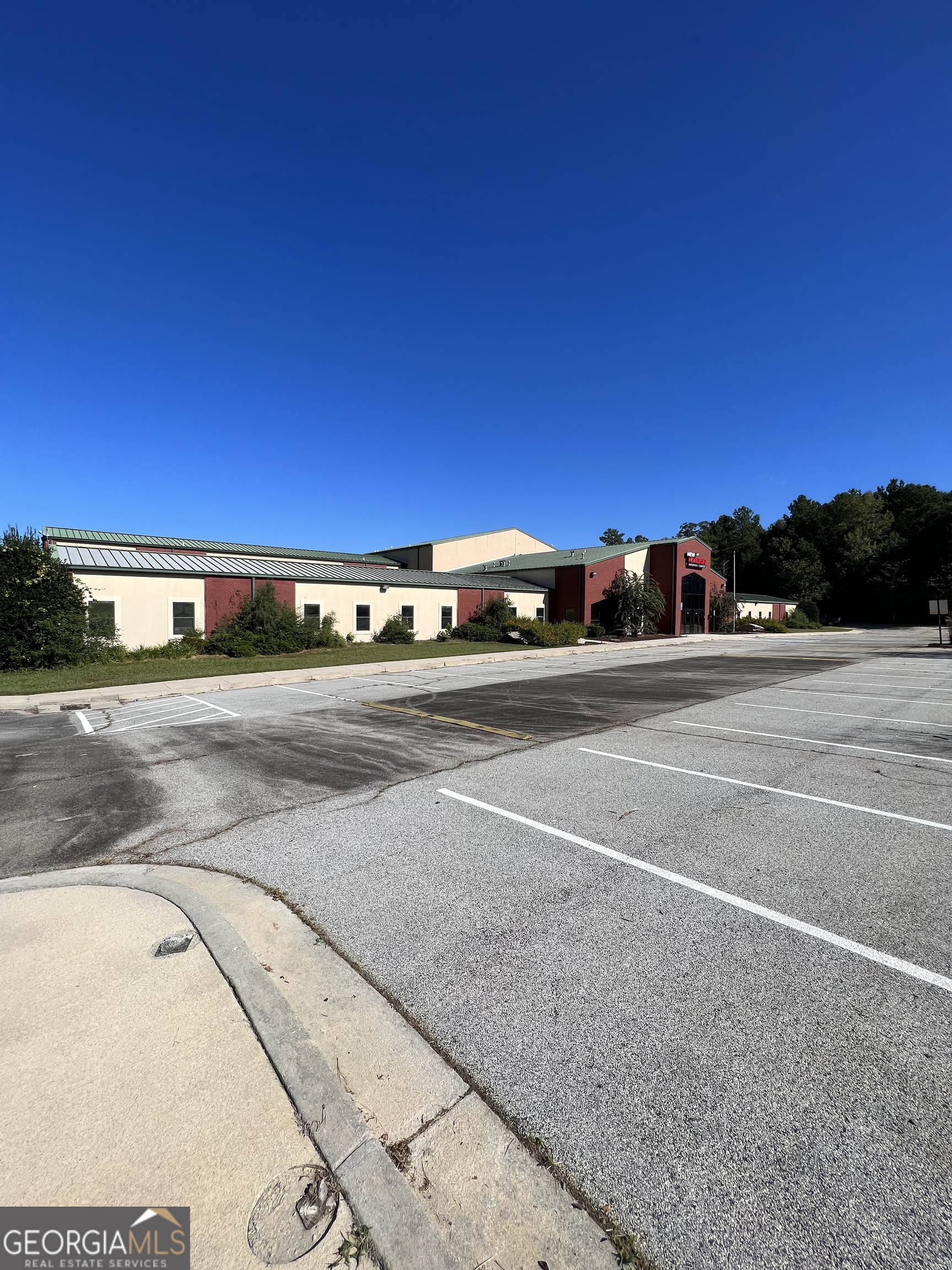 38,000A sf two-story building on 15A ac (5A ac primary site w/10A ac surplus land. Building consists of 30+ offices, 150-seat cafeteria, elevator, and 5,000A sf of warehouse space (with dock door). Property is ideal for an educational and/or religious facility. 180 total parking spaces, 6 handicap spaces. Zoned C-1.