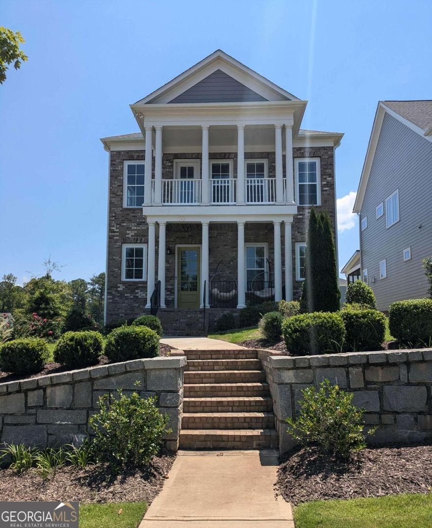 LESS THAN 1 MINUTE FROM AVALON! Welcome to 545 Hanlon Way, a charming 4-bedroom, 4-bathroom home in the heart of Alpharetta, offering an unparalleled lifestyle and prime location. This beautifully designed residence is minutes away from Avalon, with two spacious decks and a welcoming front porch, perfect for enjoying the stunning views of this vibrant area. Nestled on the most coveted lot in the community, this home offers breathtaking views of Avalon and easy access to all the amenities that make Alpharetta one of the most desirable places to live. Located just over a mile from "The Gathering," a highly anticipated $1 billion mixed-use project currently under construction, you'll be at the center of future shopping, dining, and entertainment venues. The convenience doesn't stop there-this home is also close to GA-400, Wills Park, Downtown Alpharetta, the Alpha Loop, and is situated in the highly sought-after Milton School District. Living here means you'll be at the heart of everything Alpharetta has to offer. As you step into the main level, you'll be greeted by a welcoming foyer area, leading to a guest bedroom and full bath-perfect for visitors or a home office. The terrace level offers versatile space that can be transformed into a media room, a fifth bedroom or in-law suite, and much more. The main floor features an open-concept design, seamlessly connecting the living room, kitchen, eat-in area, and dining room. Enjoy your morning coffee or evening cocktails on the back patio, which offers scenic views of Avalon and the community. Upstairs, you'll find a loft with amazing views toward Avalon, perfect for an office or playroom, along with the primary suite, which boasts a dreamy bathroom and two spacious closets. Two additional bedrooms, another full bathroom, and a convenient laundry room complete this level. With move-in ready conditions, 10-foot ceilings, and hardwood floors, this home is the perfect blend of modern luxury and convenience.