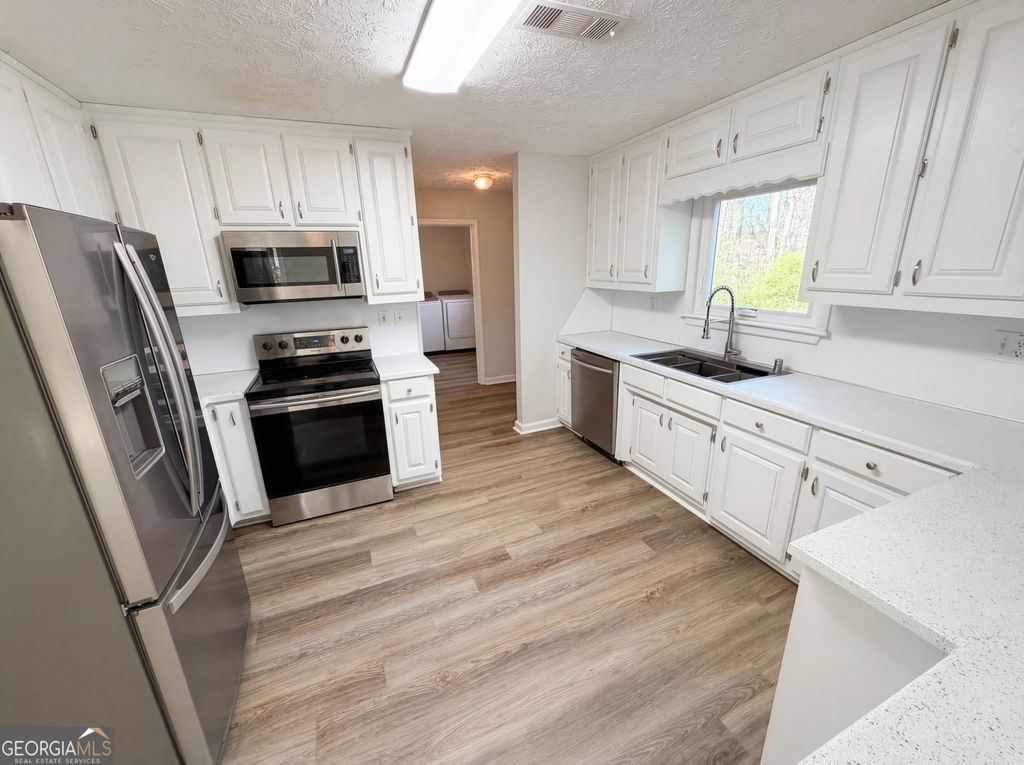 Photo of 1965 Deer Creek Trail, Buford, GA 30519 (MLS # 10716994)