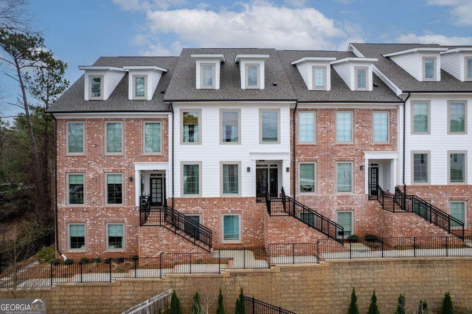Luxurious 2-Bedroom, 2-Bathroom Condo in the Sought-After Maxwell Community This exquisite property blends style, comfort, and convenience in one of Alpharetta's most desirable locations. Situated near The Maxwell's pool and just a short walk from vibrant retail, dining, and the lively downtown Alpharetta scene, this home offers unparalleled urban living. Designed with an open-concept layout, the space is bathed in natural light from expansive front and rear windows. Premium LVP flooring and fresh, neutral tones create a modern and inviting ambiance. A stunning custom-built electric fireplace serves as a stylish focal point, adding warmth and sophistication to the living area. The gourmet kitchen boasts brilliant quartz countertops, a large island with seating, sleek white cabinetry, and top-of-the-line stainless steel appliances. The primary suite provides a tranquil retreat with a custom closet organizer for optimal storage and functionality, along with a luxurious en-suite bath featuring a frameless glass shower and double vanity. A second bedroom on the lower level offers privacy and flexibility-ideal for a guest suite, home office, or personal studio. Step outside to a private covered balcony, perfect for unwinding in a serene setting. The Maxwell community offers resort-style amenities, including a sparkling pool, clubhouse, fire pits, and more. An attached one-car garage with additional driveway and guest parking ensure ultimate convenience. With easy access to Downtown Alpharetta, Avalon, the Alpha Loop, and GA-400, this home is perfectly positioned for both relaxation and adventure. Whether you're enjoying the Saturday Farmers Market or exploring downtown's shops and restaurants, this condo delivers the best of modern urban living.