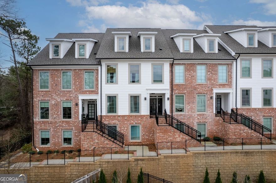 Luxurious 2-Bedroom, 2-Bathroom Condo in the Sought-After Maxwell Community   This exquisite property blends style, comfort, and convenience in one of Alpharetta's most desirable locations. Situated near The Maxwell's pool and just a short walk from vibrant retail, dining, and the lively downtown Alpharetta scene, this home offers unparalleled urban living.    Designed with an open-concept layout, the space is bathed in natural light from expansive front and rear windows. Premium LVP flooring and fresh, neutral tones create a modern and inviting ambiance. A stunning custom-built electric fireplace serves as a stylish focal point, adding warmth and sophistication to the living area.    The gourmet kitchen boasts brilliant quartz countertops, a large island with seating, sleek white cabinetry, and top-of-the-line stainless steel appliances. The primary suite provides a tranquil retreat with a custom closet organizer for optimal storage and functionality, along with a luxurious en-suite bath featuring a frameless glass shower and double vanity. A second bedroom on the lower level offers privacy and flexibility-ideal for a guest suite, home office, or personal studio.    Step outside to a private covered balcony, perfect for unwinding in a serene setting. The Maxwell community offers resort-style amenities, including a sparkling pool, clubhouse, fire pits, and more. An attached one-car garage with additional driveway and guest parking ensure ultimate convenience.    With easy access to Downtown Alpharetta, Avalon, the Alpha Loop, and GA-400, this home is perfectly positioned for both relaxation and adventure. Whether you're enjoying the Saturday Farmers Market or exploring downtown's shops and restaurants, this condo delivers the best of modern urban living.