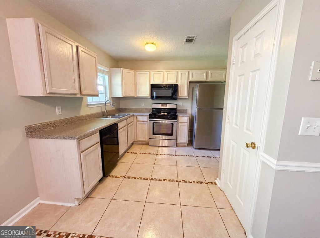 Photo of 3045 Stonebridge Creek Drive, Lithonia, GA 30058 (MLS # 10789945)