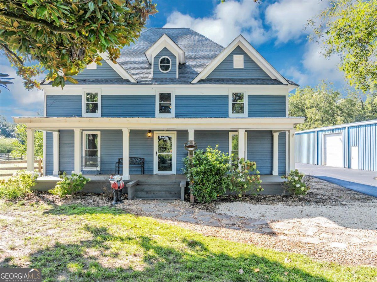 Charming Renovated 1910 Farmhouse with Modern Upgrades, Saltwater Pool, Barns & Nearly 2 Acres! Step into a perfect blend of historic charm and modern luxury with this beautifully renovated two-story 4-bedroom, 3-bathroom farmhouse, originally built in 1910 and thoughtfully updated from top to bottom. Nestled on 1.93 acres, backyard fully fenced, this property offers an exceptional lifestyle with a stunning new Pebble-tec in-ground saltwater pool and hot tub, multiple large barns, and scenic views! Inside, you'll find a spacious and bright layout with new windows, blown-in insulation, and a new heat pump for the downstairs level. The kitchen is a chef's dream with all new custom cabinetry, stainless steel appliances including an induction oven/range, and a charming new wood-burning cooking stove as a standout feature. One of the upstairs bedrooms retains its original flooring, preserved in excellent condition to maintain the home's historic character while the remainder of the home has luxury vinyl throughout. The primary suite and additional bedrooms are generously sized, and all three bathrooms have been renovated with tasteful, updated finishes. For added comfort and efficiency, the crawlspace is encapsulated with a dedicated dehumidifier. Step outside to a private oasis: * New in-ground saltwater pool with hot tub spilling into the pool * Covered back porch area * Enclosed porch area for extra storage * Separate pool shed with a covered "stage" area overlooking the pool-perfect for entertaining * Huge 40' x 60' enclosed steel barn, built to withstand up to 180 mph winds, with an additional 20' covered area and additional gravel RV parking pad * 30' x 40' open covered pole barn and new gravel parking area * New asphalt driveway and irrigation in front and side yards Enjoy the beauty of nature with mature pecan trees, a 100-year-old magnolia tree in the front yard, professionally pruned, and a peaceful fenced pasture for animals. A private road leads you in, offering serene sunset views over neighboring pastures from your front porch. With all-new cypress siding, upgraded drainage systems, and countless thoughtful updates, this home is turn-key and ready for you to move in and enjoy! A truly unique and rare find-schedule your private showing today!
