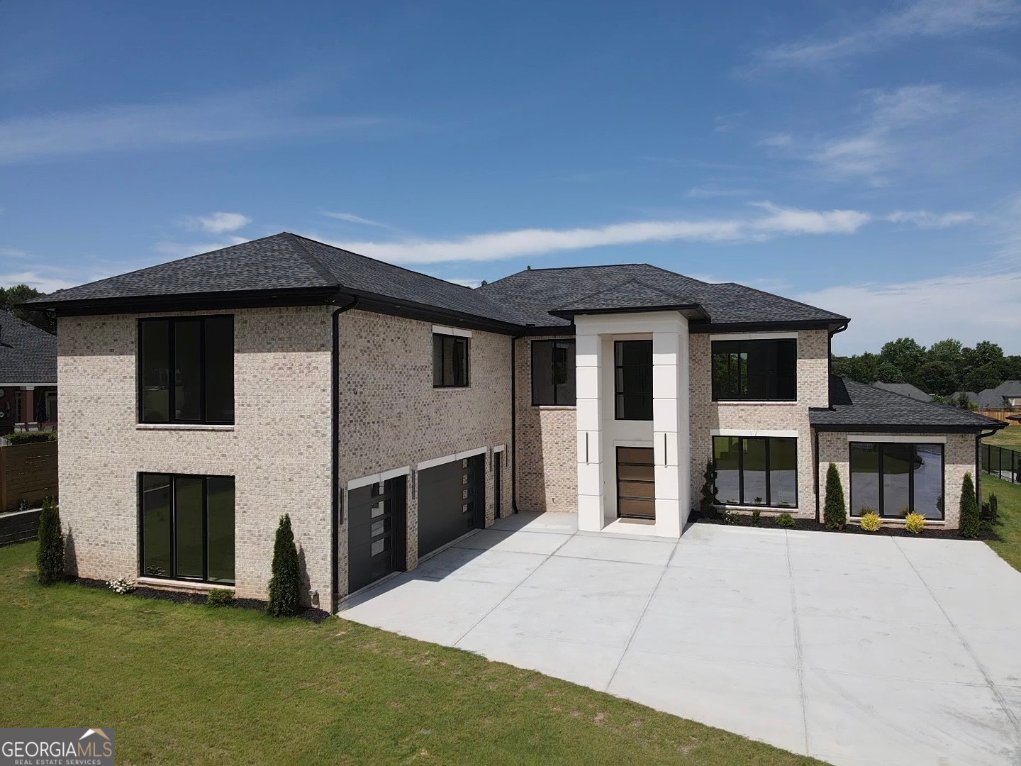Stunning Modern New Construction Home located on Camp Branch Rd. in Gwinnett County. The grand two-story foyer leading into the sensational, breathtaking 22-foot living room is adorned with European windows that flood the space with natural light. With its open-concept layout, the living room flows seamlessly into the dining area, offering an inviting space for gatherings and celebrations. Step into the kitchen of your dreams, where all your hosting dreams come true. Including a scullery allows you to keep the mess out of sight, letting you focus on creating memorable experiences with your guests. The primary ensuite on the main floor is truly the room of your dreams, offering a perfect sanctuary that seamlessly blends luxury and comfort. A stunning sliding door opens to invite you to enjoy fresh breezes or peaceful mornings. The lavish bathroom features full tile walls and floors, exuding elegance with every step. Upstairs, you'll find three additional bedrooms, each with its own ensuite bathroom and walk-in closet, providing privacy and convenience for family and guests alike. Every closet is adorned with custom shelving that enhances organization and accessibility, making this home not only stunning but also exceptionally functional- truly a haven for modern living. During those warm summer days, you'll have the perfect opportunity to take advantage of your outdoor kitchen area, complete with a grilling section that's truly a chef's dream! Imagine hosting barbecues and gatherings with family in this beautiful space, creating lasting memories under the sun. Plus, with the option to design a future pool area, you can enhance your outdoor oasis even further. With an outdoor shower and bath already built-in! Situated in highly sought after Gwinnett county location close to top-rated schools, shopping, restaurants, and entertainment.