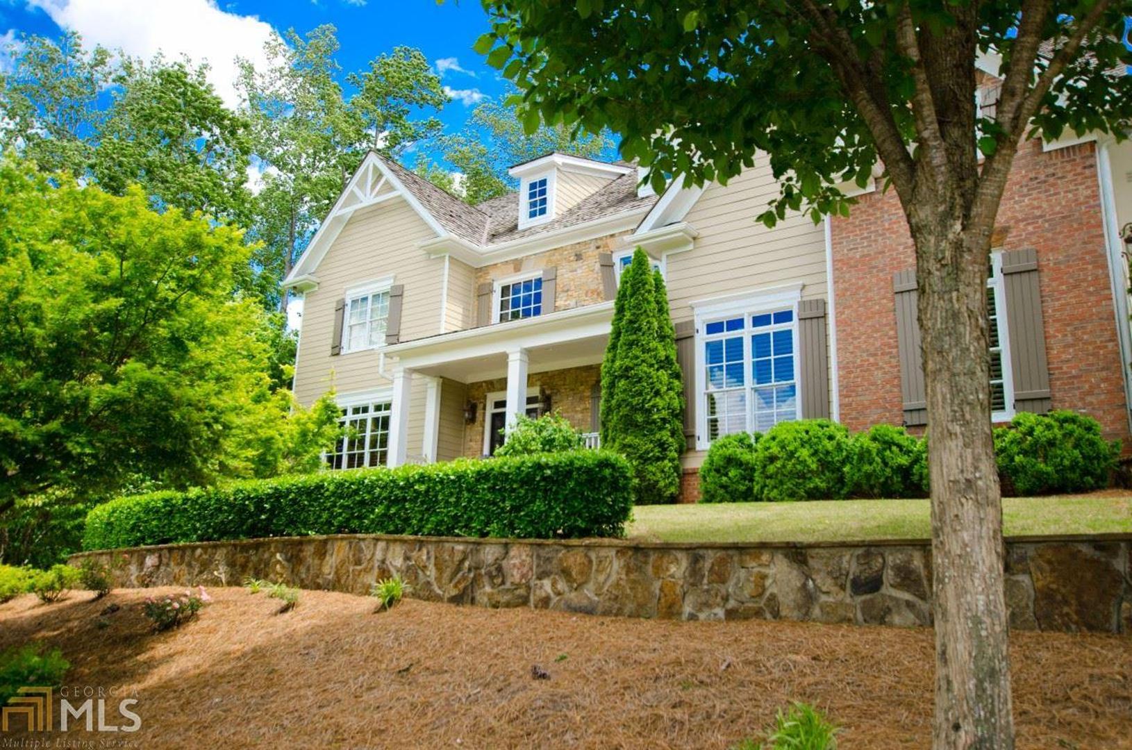 Beautiful and classic Six Hills home with everything you want & need. Wonderful Front Porch with scenic views. Master on Main boasts stunning bath, wet bar, sitting area, & fireplace. Main Level has Chef's Kitchen & Eating Area, massive walk in Pantry, Mud Room area with shelves/hooks/lockers just off 3 Car Garage. Living, Keeping & Study Rooms each with a fireplace, and Banquet Dining Room are among the incredible amenities of the Main Level. Living Room, Master and Keeping Room overlook gorgeous salt water Pool & covered outdoor living space with fireplace, grilling area & stone patio. Back yard is spacious & beautifully landscaped. The Upper Level has a Second Master Suite w/fireplace, 3 additional Bedrooms, each with full Bath & a Media Room with fireplace. Daylight Terrace level has full kitchen, 6th Bedroom, full Bath, large Office, Gym with Monkeywood floors. Playroom which could be a second Media Room & a secluded finished room which could be used as conditioned storage or a "Safe Room". Tons of storage space round out the lower level. This is a spectacular home in the most coveted neighborhood in the area. Convenient to Crabapple, other entertainment areas, and excellent schools.