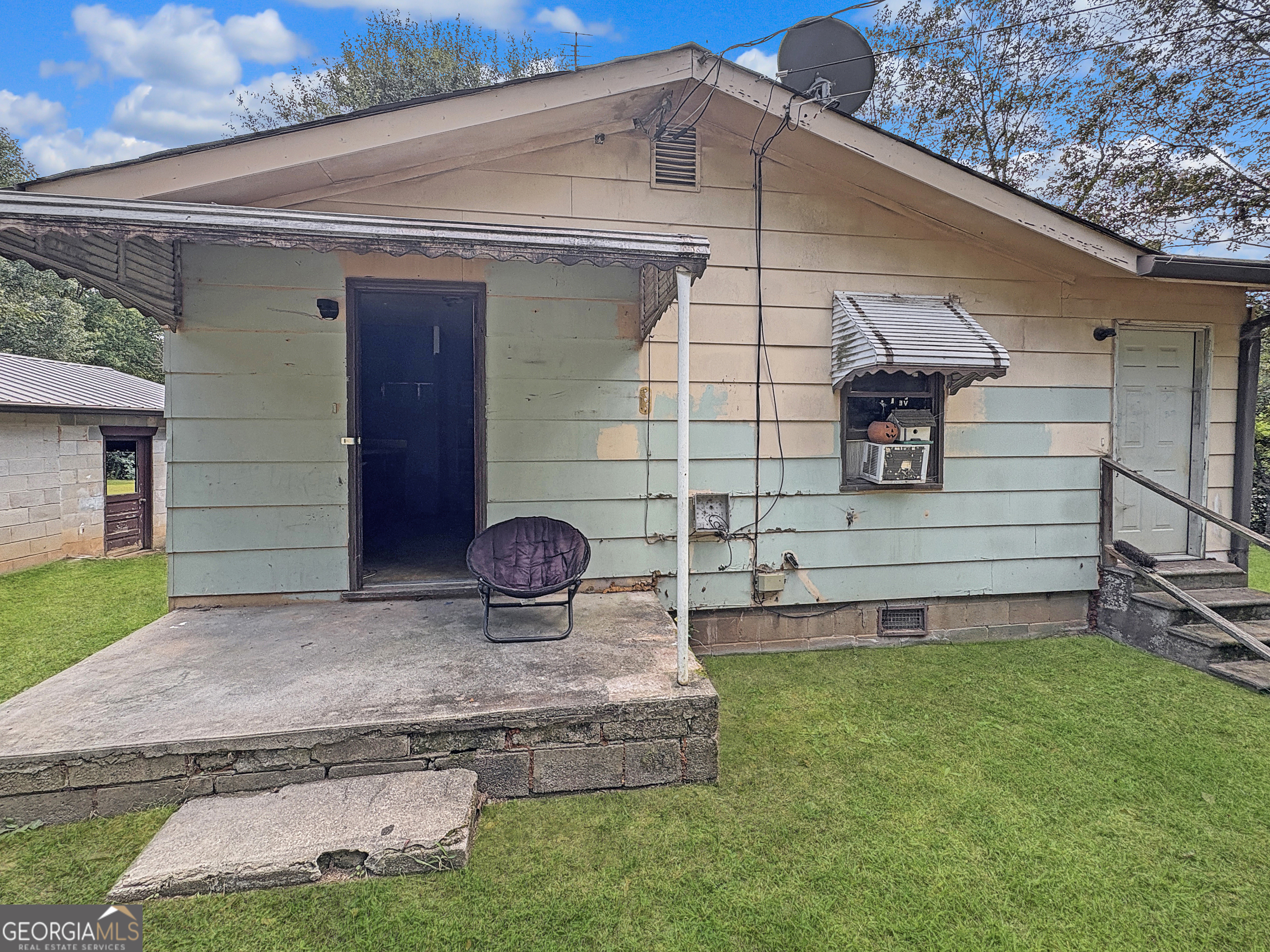 Investor Special - Fixer Upper with Huge Potential! This property is a perfect opportunity for an investor or a small family ready to put in some sweat equity. Featuring solid bones and a good roof, this home is in need of a full cosmetic rehab to bring it back to life. Sitting on a beautiful, flat 1-acre lot, the yard is fully fenced with durable chain link fencing - ideal for pets, kids, or simply enjoying the extra space. The property also includes an outbuilding with power, making it a great option for storage, a workshop, or future projects. Additional highlights include: Septic system pumped just two years ago Utilities available, but currently off and not in use for over a year Conveniently located near shopping, dining, and healthcare With the right vision, this home has endless possibilities. Whether you're looking for your next flip, rental investment, or a budget-friendly project home, this property checks the boxes.