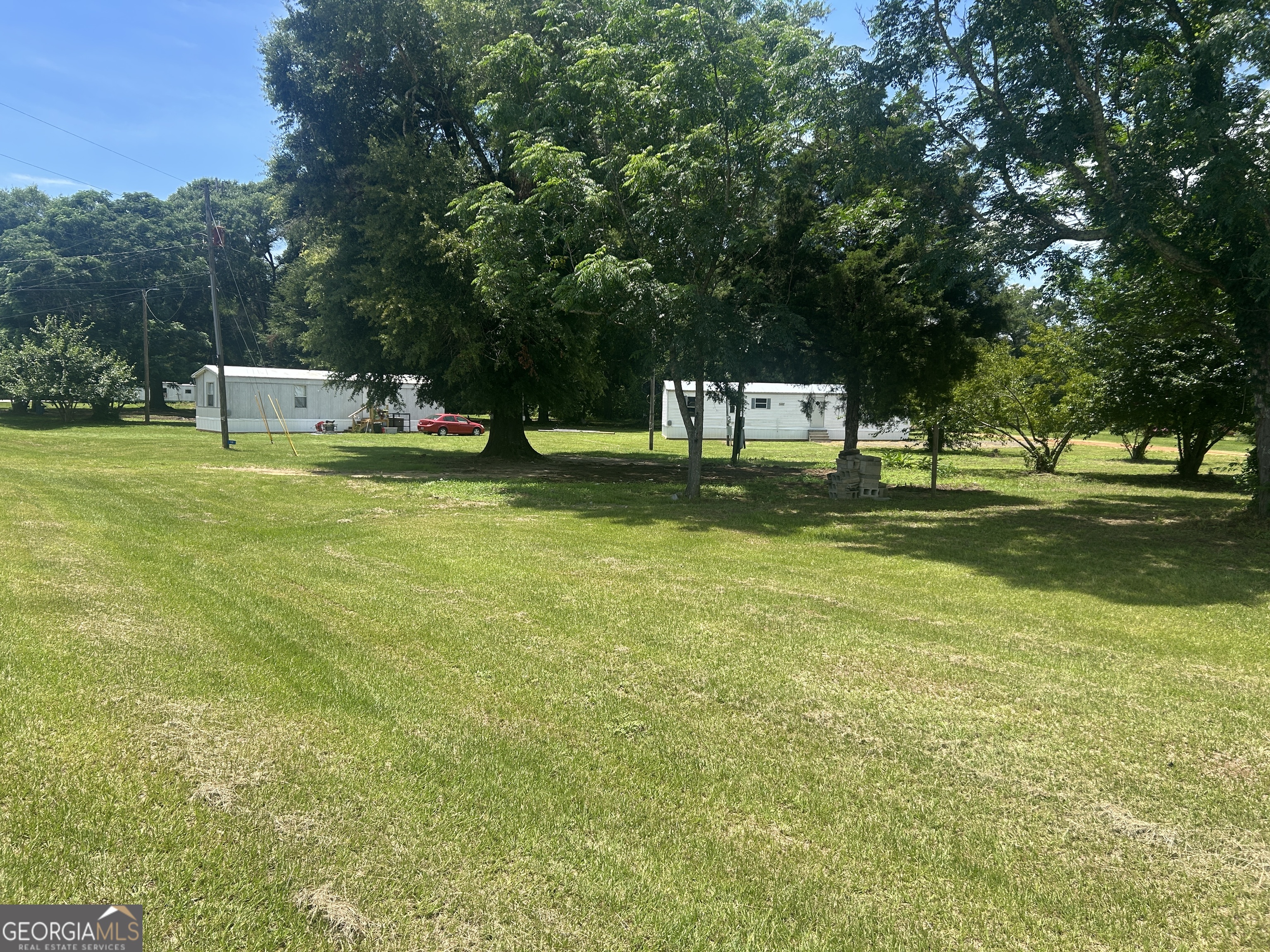 Investor Alert! Check out this cash-flowing opportunity featuring not one, but three mobile homes situated on over 2 acres of land. Currently bringing in $1,500 in monthly rental income, this property still has room to grow with the possibility of adding a fourth mobile home for even greater returns. Each home offers 2 bedrooms and 1 bathroom, making them ideal for long-term tenants. Whether you're looking to expand your portfolio or start investing in real estate, this multi-unit setup offers a strong foundation with value-add potential.