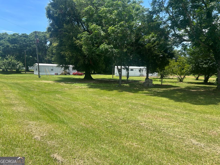 Investor Alert! Check out this cash-flowing opportunity featuring not one, but three mobile homes situated on over 2 acres of land. Currently bringing in $1,500 in monthly rental income, this property still has room to grow with the possibility of adding a fourth mobile home for even greater returns. Each home offers 2 bedrooms and 1 bathroom, making them ideal for long-term tenants. Whether you're looking to expand your portfolio or start investing in real estate, this multi-unit setup offers a strong foundation with value-add potential.