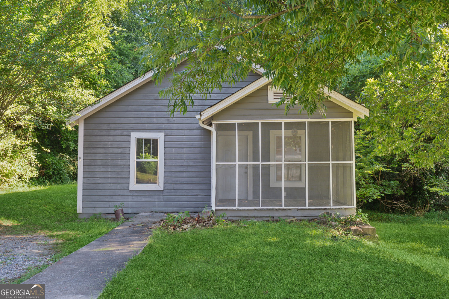 Charming bungalow just waiting for a new buyer to bring out it's potential. Lots of outdoor possibilities with a screened in porch in front and brand new deck in the back, all on over a third of an acre. The neighborhood is enjoying a resurgence with new homes being constructed and older homes being remodeled. The home is walking distance to Historic Downtown Rockmart and all it has to offer including many diverse restaurants and shops. Also, close to Nathan Dean Bypass, Highways 278, 113, and 101 and the Silver Comet Trail. Home is being sold as is due to needed work and is priced accordingly. Conventional or cash only. Will not go FHA or VA.
