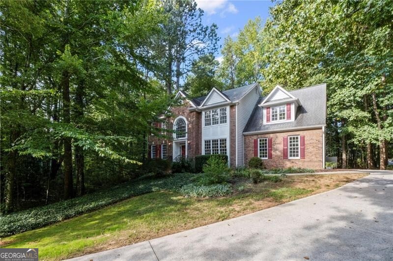 Do not miss this gem in sought-after Charleston Pointe! Private lot, curb appeal, all close to historic Roswell district with top-rated schools! Six bedrooms, fully finished basement with a kitchen, bar, and wine storage. The basement also has a full bath and workshop! New carpets and refinished hardwoods make this move-in ready! A bright and light two-story foyer welcomes you, featuring an oversized dining room and a formal living room/office. Kitchen with stone counter tops, custom tile and a large eat-in area opens to two two-story family room. First-floor bedroom with handicap bath access. This well-loved home is ready for your new memories!