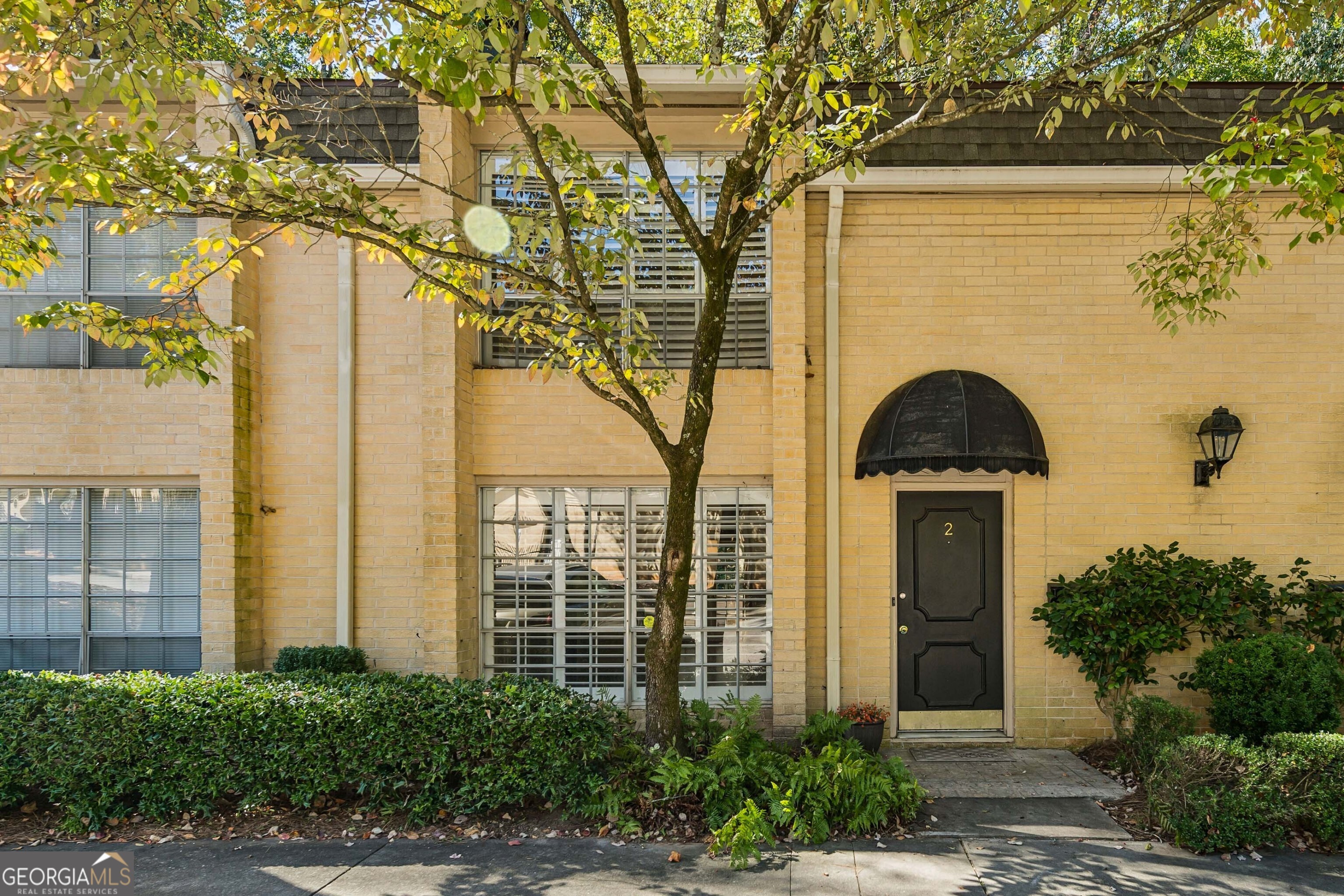 This charming condo is located in the Round Hill community, just minutes from GA-400 and I-285 for easy commuting. Enjoy having everything you need right nearby   The Prado Shopping Center, great restaurants, gyms, spas, hospitals, and more   plus quick access to Buckhead and Dunwoody.  Step inside to a bright two-story foyer with a beautiful curved staircase that makes a great first impression. The main level features a spacious living room with hardwood floors, floor-to-ceiling windows that fill the space with natural light, and a cozy fireplace for relaxing nights at home. The separate dining room opens through French doors to a private patio   perfect for morning coffee or unwinding at the end of the day.  The kitchen features updated countertops, white cabinets and plenty of storage!  Upstairs, the primary suite includes a full bath and lots of natural light. An additional bedroom offers plenty of closet space and a walk-in closet. Another full bath completes the upper level.  Move right in and start enjoying everything this wonderful home and community have to offer. Don't wait   schedule your showing today!