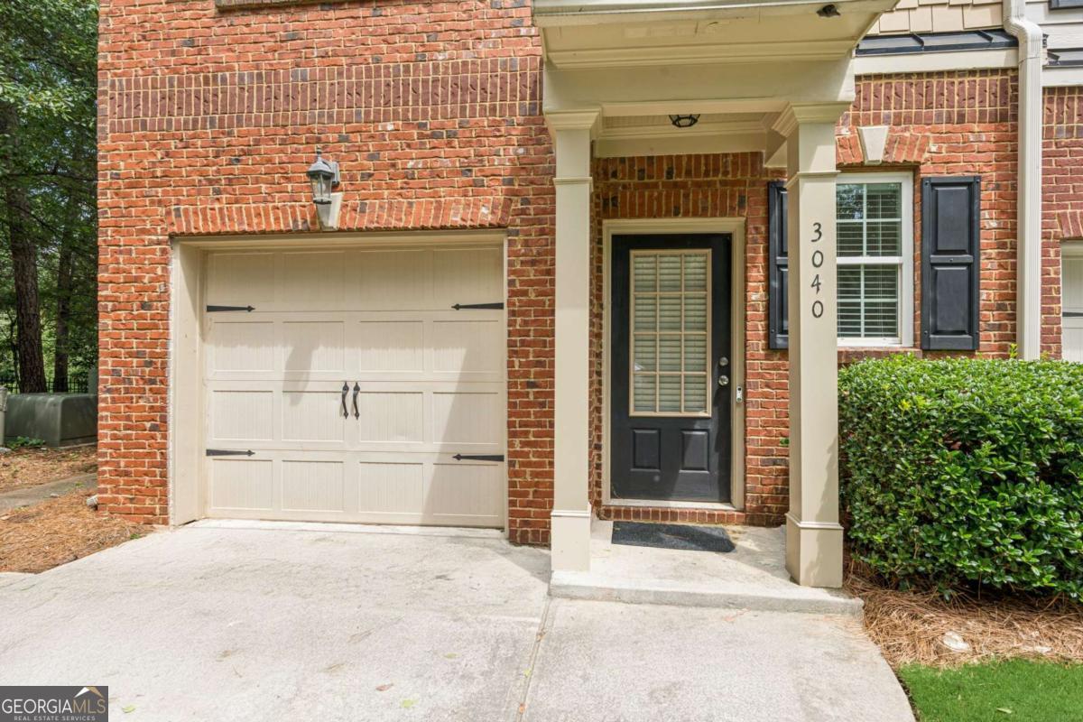 Welcome to this stunning end-unit townhome, perfectly located for modern living. Nestled in a prime area close to shopping, dining, and with quick access to major highways, this home offers the ideal blend of convenience, comfort, and style. From the moment you arrive, the private side entry sets this home apart, while large windows fill the interior with abundant natural light. Inside, an elongated hallway leads you into the heart of the home. The open U-shaped kitchen is a chef's delight, featuring a gas oven/range, microwave, refrigerator, and a spacious sink. Designed for both everyday meals and entertaining, the kitchen flows seamlessly into the expansive great room with its cozy fireplace and adjoining dining area-perfect for gatherings with family and friends. Upstairs, the oversized primary suite is a true retreat. Enjoy the luxury of a huge walk-in closet and a spa-like bath complete with a separate tub and shower. Two additional guest bedrooms with vaulted ceilings share a well-appointed hall bath, while a dedicated laundry room adds everyday convenience. Additional highlights include a 1-car garage, flat driveway, and ample parking. Don't miss this incredible opportunity to own a townhome that offers privacy, style, and unbeatable location. Schedule your tour today and experience the lifestyle this remarkable home has to offer!