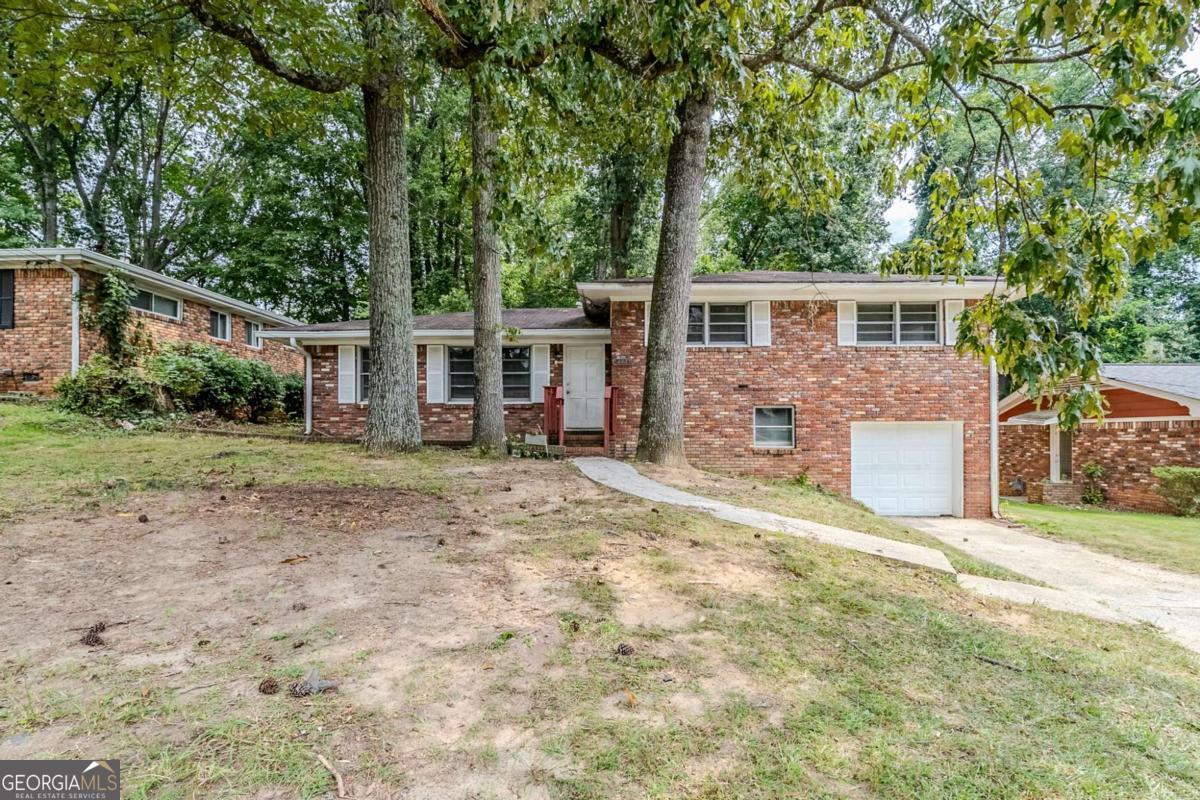 Welcome to this charming split-level home in the Tucker Heights community. Offering 3 bedrooms and 2 baths, this home is thoughtfully laid out with comfortable living spaces ideal for both relaxation and entertaining. The main level includes a spacious great room and a separate dining area, creating a warm and inviting flow. Upstairs, you'll find well-sized bedrooms that provide privacy and functionality for everyday living. The partial basement adds bonus space that can be customized for storage, a home office, or recreation. Schedule a showing today. One or more photos have been virtually staged.