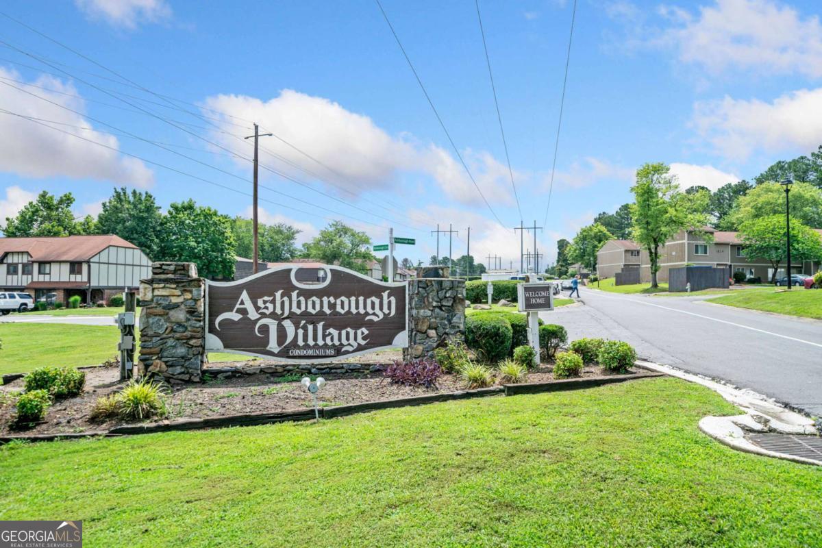 GREAT OPPORTUNITY!!! Three Bedroom Townhome in Marietta for LESS Than $200,000!!! Come See this Awesome Home in an Incredible Location. Close to I-75, Dobbins AFB, LIFE U, Kennesaw U, & Truist Park Stadium. First Floor has Ceramic Tile in the Foyer & Hall, Dining Room & Kitchen. Great Room has Laminate Wood. Large Dining Room can also be used as a Flex Room. Kitchen has White Cabinets, Dark Countertops w/ a Granite Composite Farm Sink, Black Appliances w/Gas Stove & Microwave. Continue Through to the Great Room which could accommodate a Dining Area and Overlooks an Enclosed Patio and Lush Garden thru the Newer Sliding Glass Door. Back through the Hall which has a 1/2 Bath, Laundry Closet with Washer & Dryer ( that remain) and big Storage Closet. Second Floor has New Laminate Stairs and LVP in the Bedrooms all Matching. Main Bedroom has Double Large Windows, Wrap Around Corner Closet, Fresh Paint. Secondary Bedrooms have Large Window, Ceiling Fans and Fresh Paint. Third Bedroom has Wall Mount and TV that is Staying.. Both Overlooks Scenic Greenery. Full Bath has Separate Vanity & Private Combo Tub & Shower & Toilet, w/ Linen Closet and Storage Shelves. Two Assigned Parking Spaces. HOA Includes: Water & Sewer, Gas, Trash Pick Up, Termite & Pest, Exterior Maint., Landscaping in Front Yard & Common Areas, Pool, Tennis, Playground & Dog Park and More! Move In Ready! Great Value!