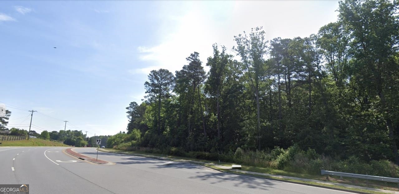 Rare opportunity for commercially-zoned land on Castleberry Road. Approximately 5 acres of Commercial Neighborhood Shopping. Land Disturbance Permit on-hand and valid, ready to begin clearing and grading. Castleberry was recently widened and is a bypass to GA400 and Hwy19. The Forsyth UDC allows extensive permitted uses and additional conditional uses in NS (udc_014_ch12). The currently building regulations provide for construction of a 48,591 sf building. All utilities are available.