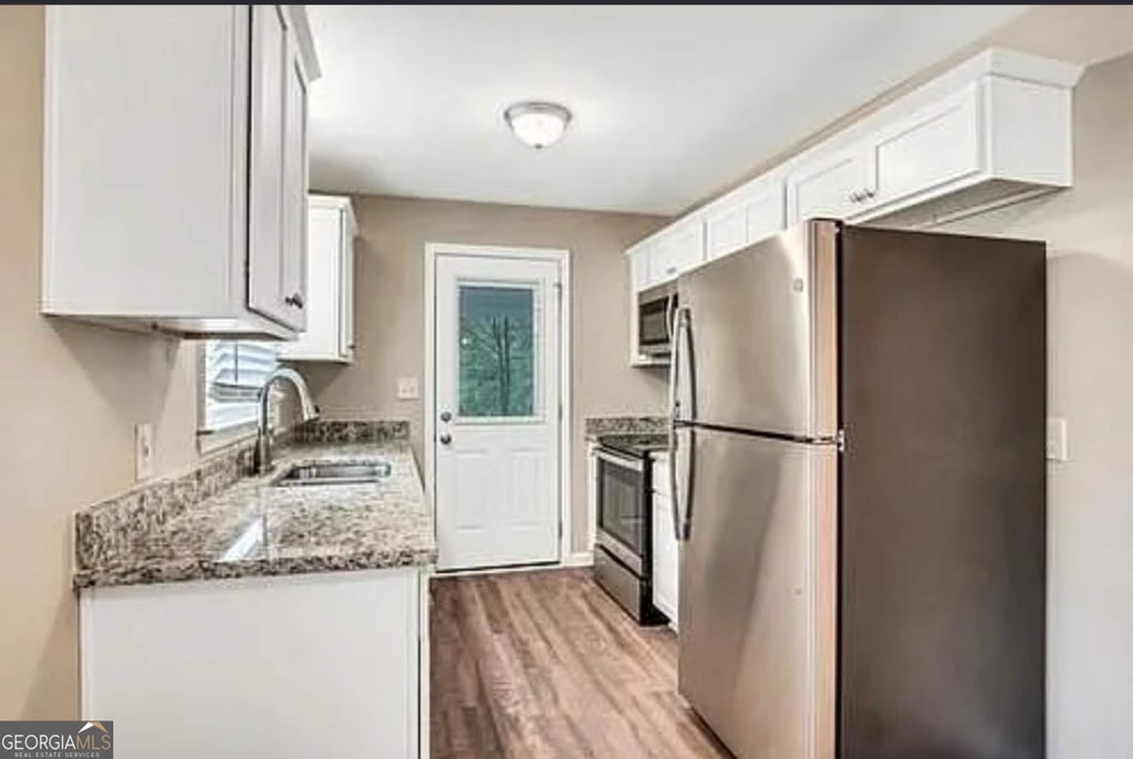 Photo of 6263 Green Acres Drive SW, Covington, GA 30014 (MLS # 10849395)