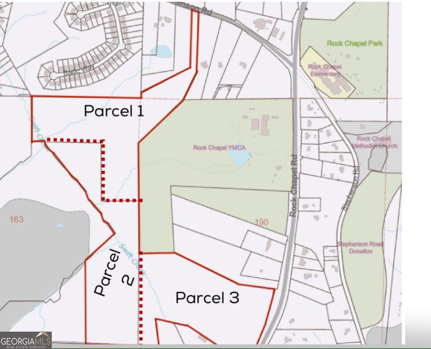 Unlock the potential of Lithonia's next premier residential community. Positioned along Rock Chapel Road, this 30-acre tract-part of an active assemblage totaling approximately 67-90 acres-offers developers and investors a rare opportunity to build a master-planned community in one of DeKalb County's fastest-growing corridors.    Zoned RSM (Residential Small Lot Mix), the property supports 4-8 units per acre, ideal for both single-family detached and attached home designs. The site features approved sewer, driveway access, and a conceptual site plan already in place, streamlining the path to development.    Conveniently located near I-20, Stonecrest Mall, downtown Lithonia, parks, and schools, this property combines accessibility with future growth potential. The terrain offers gentle topography and utility access, making it both buildable and ready for design.    This is one of the few remaining large, well-positioned tracts in Lithonia ready for residential development.