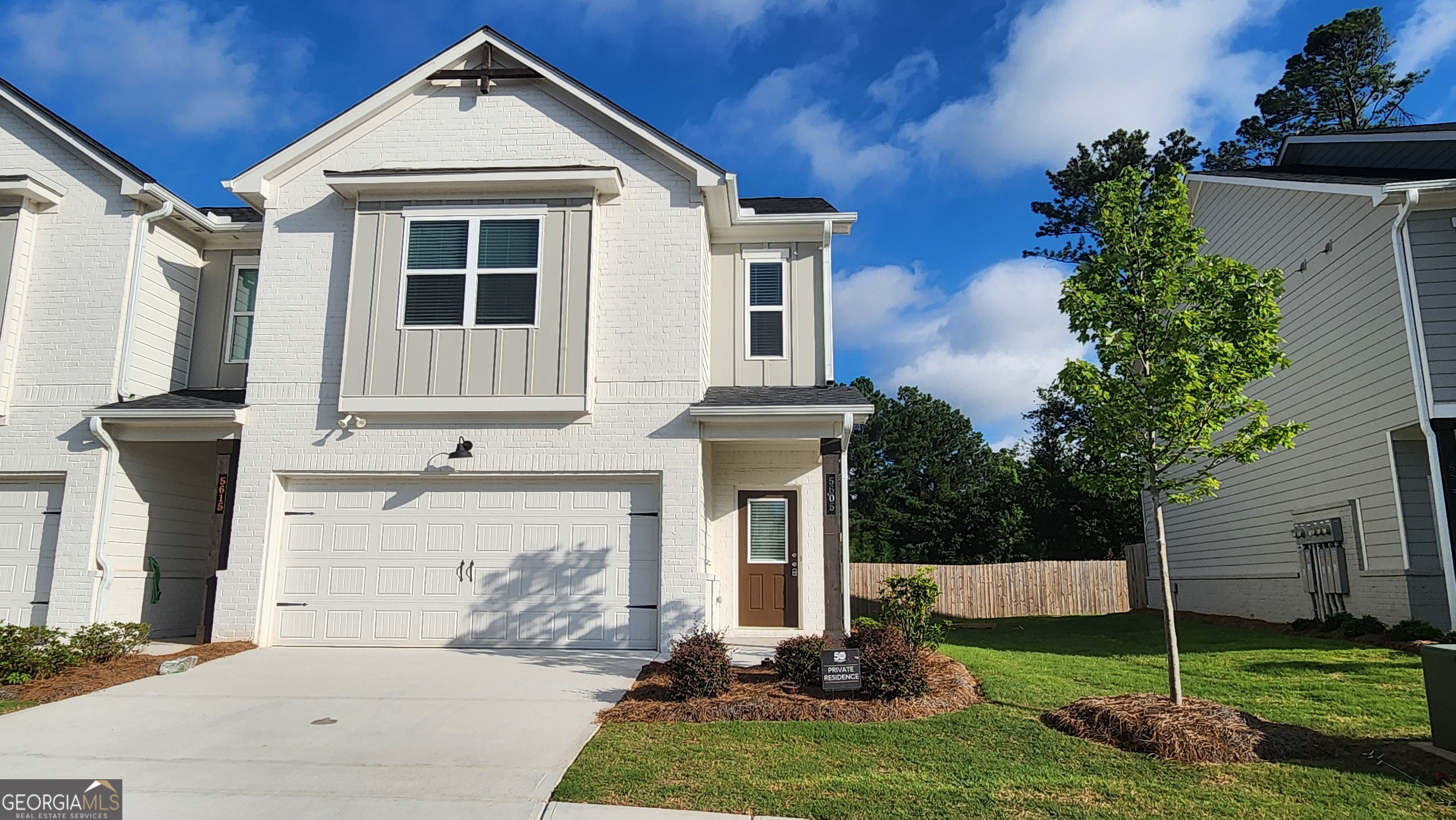 Stylish 3 Bed , 2.5 Bath End Unit in Townhome in Gated Community ! Step into this beautifully maintained 2023 built end unit townhome, located in a secure gated neighborhood with exceptional curb appeal and modern finishes throughout. Inside you'll find fresh interior paint, a spacious and inviting open-concept main level featuring a bridge living area and a sleek kitchen outfitted with stainless steel appliances, a large center island, tall white cabinetry, tile backsplash, and stunning stone countertops- perfect for entertaining or relaxing in style. Enjoy the privacy of your back patio, along the convenience of a 2 car front entry garage. Upstairs, a split bedroom layout surrounds a versatile loft area, ideal for additional living, office, or flex space. The laundry room is thoughtfully located on the upper level for easy access. This home blends comfort, style and functionality - all within a gated community.