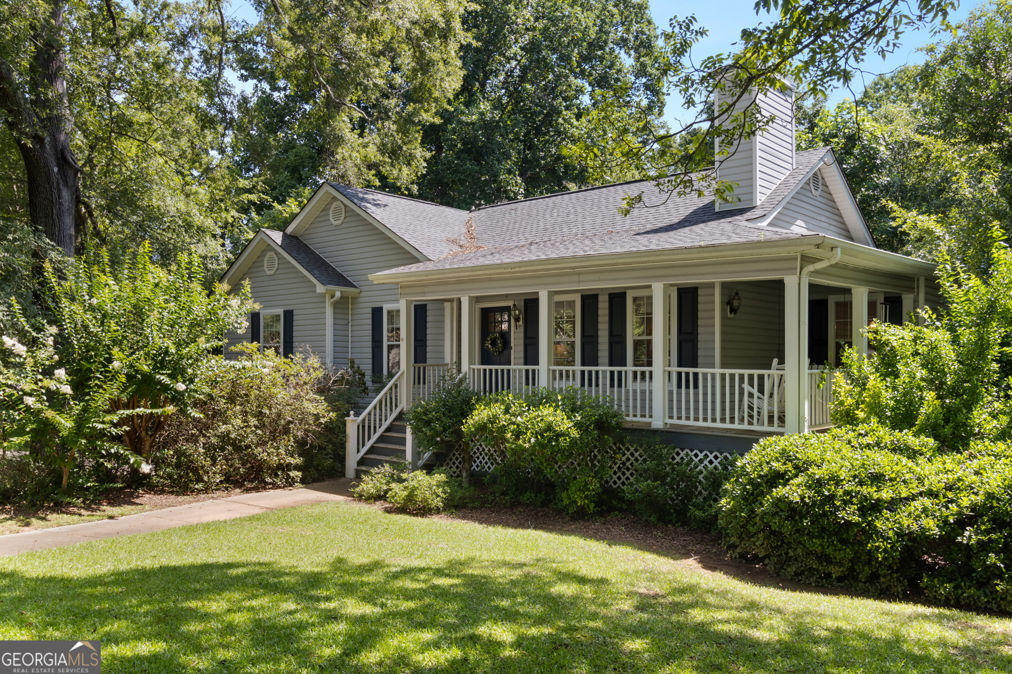 Come home to this cozy cottage in a quiet Madison neighborhood close to our award-winning charter schools and recreation facilities. It's rare to find these features under $400K - basement, 3/4 acre lot adjoining Saye Creek, fenced level backyard, deck and wraparound front porch - plus simply amazing towering hardwoods. From the moment you step into the living room, you'll feel the love in this home - the vaulted ceiling, gas fireplace, and large windows create an inviting space. Imagine meals overlooking your very private backyard. The kitchen is the hub of daily life - you can prepare meals and cleanup while chatting with loved ones and guests. The primary bedroom will be your private retreat - trey ceiling and ensuite bath with deep soaking tub and separate shower - overlooking the private back yard. A pair of secondary bedrooms share the hall bath. The lower level has a pair of large finished rooms - let your imagination soar. Will you use them for home office or crafting, for a family room, or add a bathroom and kitchenette to create a private suite? The two bay garage on this level is accessed by a circular drive - convenient for the household with multiple cars. The roof and HVAC are newer, and the home has been well maintained by the long-time owners. Bring your Pinterest boards and make this home yours. The lot is special - 3/4 acre corner lot abutting Saye Creek. The home design takes full advantage of the topography, with the main level ranch and daylight basement. The backyard features a large fenced yard plus an additional unfenced area that adjoins the creek. Imagine sipping coffee on your deck while deer and wildlife play in your yard. Pinecrest is a low-key in-town Madison neighborhood about a half mile stroll to the school complex and a mile to downtown shops and restaurants.