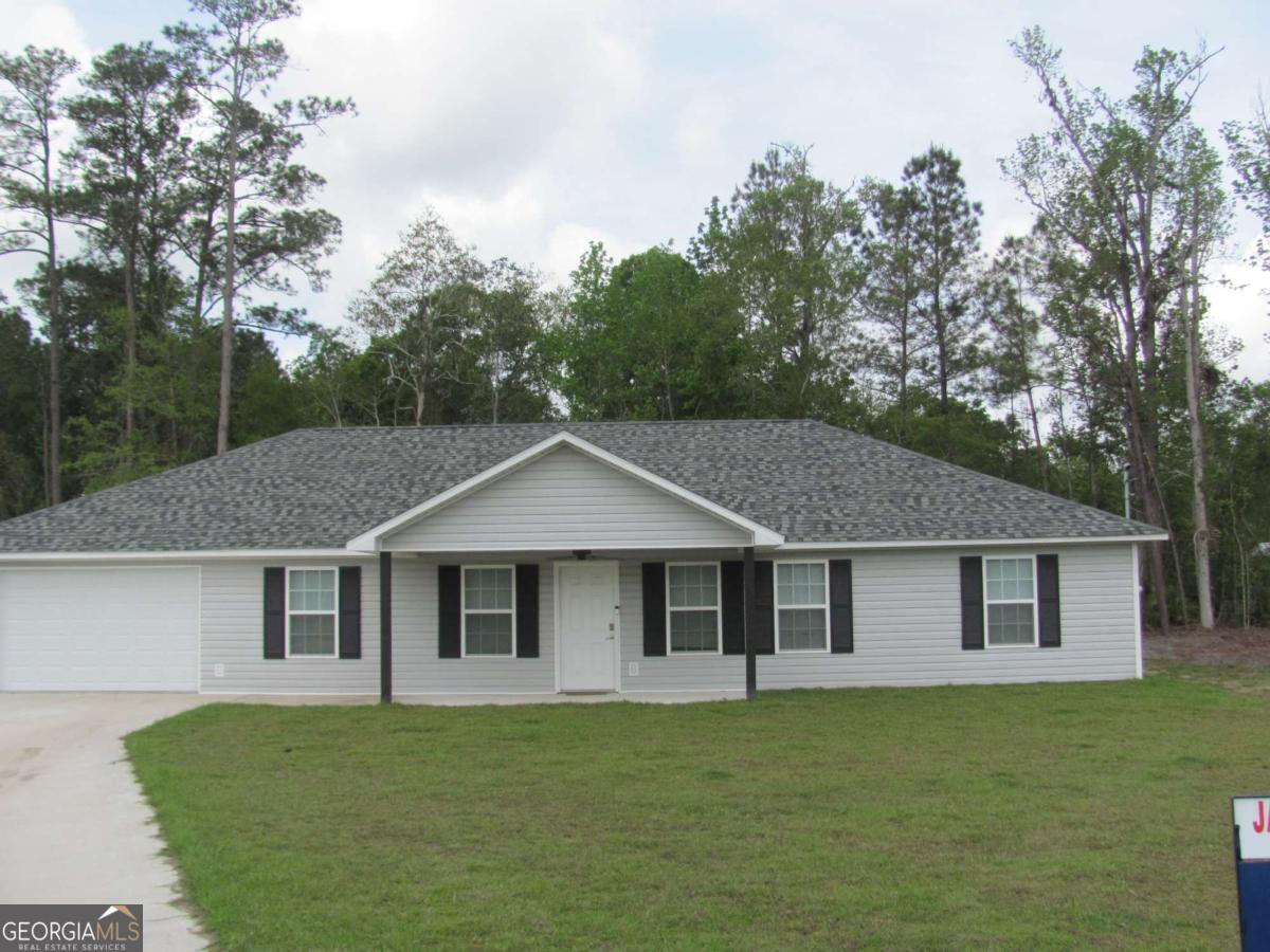 PRICE REDUCTION! Like new home in the quiet and serene neighborhood of Hawk's Landing. This 3 bedroom and 2 bath home has a split floor plan and a huge family area that accommodates the kitchen, dining area and living/family room. The room in the kitchen is endless and the stainless steel appliances are a real plus. The house was only lived in 4 months so everything is like new. The guest bedrooms have walk in closets as does the generous master bedroom. The laundry room is bigger than average and there is actually access to the master bath from the laundry room. This attractive home is at the end of a cul de sac so that eliminates all the drive by traffic. This one is easy to see so call today for a showing.