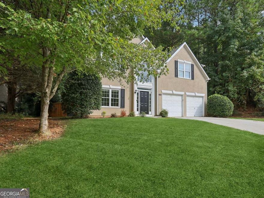 Nestled high upon the enchanting crest of Blackjack Mountain, where breezes whisper through treetops and sunsets spill golden light over cobblestone paths, awaits a residence as charming as any storybook manor, welcome to 1080 Soaring Way. This lovingly maintained gem, resting in the heart of the coveted Eagle Ridge community, greets you with an air of quiet nobility, its stately facade adorned in fresh coats of paint that gleam under the morning sun. A wide, level lawn unfurls before you like a velvet carpet, while a whimsical fenced garden awaits your afternoon daydreams and twilight gatherings.    Walk inside and be transported to a place where ceilings soar more than 20 feet high, lifting your spirits as light dances through expansive windows. The two-story foyer spills effortlessly into an open-concept realm, where the great room hums with warmth from the fireplace and laughter from cherished guests. Newer floors gleam beneath your feet, leading you to a kitchen fit for royalty, where sparkling stone countertops, updated cabinetry, and stainless steel appliances invite culinary magic.    Wander further and discover spaces thoughtfully designed for everyday living and fanciful escapes. The upper level reveals four generous chambers, including a dreamy primary suite with trey ceilings, walk-in wardrobe, and a spa-like bath ready to wash the day away with its soaking tub and separate glass-enclosed shower. Each room whispers tales of comfort, peace, and potential.    Outside, a realm of possibility unfolds in the backyard, fully fenced, lushly level, and ready for frolics or fireside tales under the stars. Here, you are not just buying a home; you are entering a kingdom of calm, nestled within one of East Cobb's most charming enclaves.    And oh, the wonders beyond your doorstep! Just minutes from the historic magic of Marietta Square, where you can stroll cobbled streets to the chime of church bells and enjoy fine dining, local boutiques, and performances at the Earl and Rachel Smith Strand Theatre. For livelier fare, venture to the lively Atlanta Battery and Truist Park to cheer on the Braves, or sip craft cocktails under city lights. The vibrant avenues of downtown Woodstock await to the north, while the great highways, I-75 and I-575, ensure your carriage rides swiftly to and from the realm.    Here in Eagle Ridge, the community is close-knit, the views of Kennesaw Mountain are nothing short of majestic, and life atop the mountain feels delightfully above it all. Whether you're drawn by the serenity, the splendor, or the storybook setting, one thing is certain, your next chapter begins at 1080 Soaring Way. And it's going to be a beautiful one.