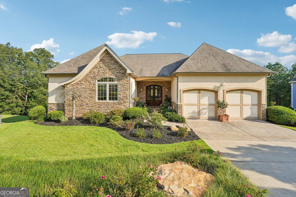 Photo of 233 Towering Peaks, Canton, GA 30114 (MLS # 10867216)
