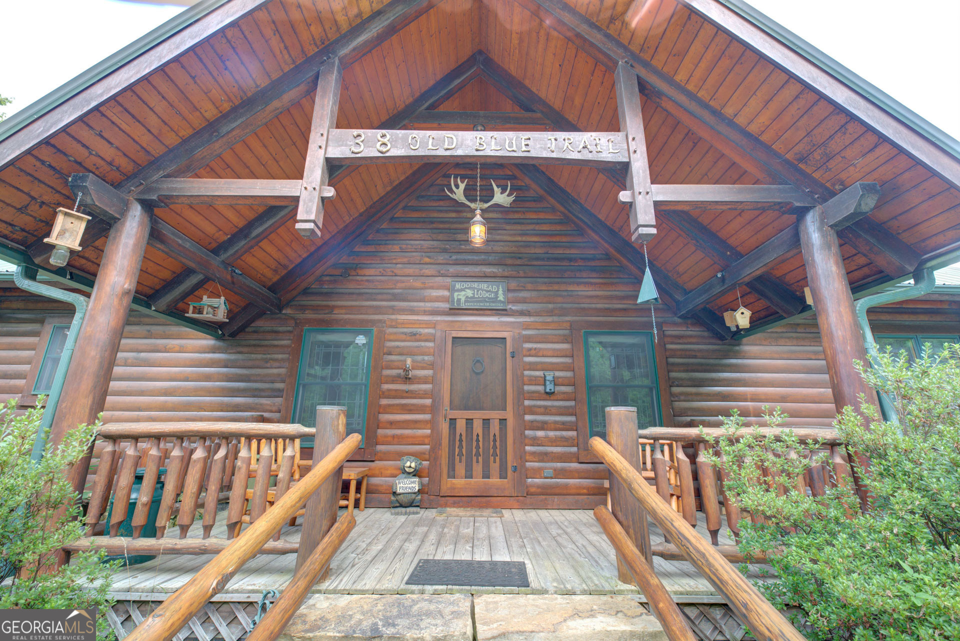 Your Lodge-Like Mountain Retreat Awaits in Rabun County, GA! Discover unparalleled tranquility and breathtaking long-range views from this custom BK Cypress Log Home, nestled on a sprawling 6.78 acres in the desirable Northridge Subdivision on Tiger Mountain (Lots 47 & 54). Built and meticulously customized by Bert Carpenter in 2006. BK Cypress logs feature triple tongue and groove logs. Step inside to a stunning great room that boasts a striking rock-faced wood fireplace with a gas starter and a custom, hand-picked, and very rugged log mantel crafted by the builder. This is complemented by a magnificent 24-foot cypress tree extending vertically from floor to the ceiling ridge beam. The great room also features floors of hard pine from an old cotton mill and carefully selected light fixtures that perfectly complement the lodge-like feel. This open-concept living area, with its soaring ceiling, flows seamlessly into the kitchen and dining area, adorned with a real antler chandelier, and offers captivating mountain views through abundant patio doors and large glass windows. The covered porch off the great room features a towering roof supported by cedar logs, providing an impressive outdoor living space. The gourmet kitchen and custom washroom cabinets are crafted from reclaimed hardwood pine from an old cotton mill, adding unique character. All cabinets throughout the house were custom-made by the builder. You'll also find a convenient walk-in pantry with "pie safe" doors. Adjacent to these living spaces, you'll find a comfortable master bedroom with a vaulted ceiling, a gas log fireplace with custom red cedar mantel, and a patio door directly to a covered porch. It includes two walk-in closets and a luxurious master bathroom featuring heated travertine floors, a large walk-in travertine shower, a Jacuzzi tub, and custom light fixtures fitting the home's character. A parlor, half bath and laundry area complete this main level. The open loft offers flexible space and a great view through the large glass of the great room below. The cedar log railings for the stairs to the loft and the loft itself enhance the rustic aesthetic. The walk-out basement or terrace level provides a full bath, two comfortable bedrooms, and a versatile sitting room suitable to add a mini kitchen to serve guests, with its own separate outside access and practical hallway/mudroom with sink and a walk-in pantry. Keep comfortable year-round with a 3-zone HVAC system, humidifier, and dehumidifier. The home also benefits from both county water and private well water. Parking is ample with a tuck-under garage for one car and an ATV, plus a dedicated workshop area. Recent upgrades enhance peace of mind, including new handrails and decking in 2024 on the wraparound deck. All screws in the metal roof replaced in 2024. For a truly seamless move, this incredible log home is offered mostly furnished. Beyond your private retreat, immerse yourself in the natural wonders of Rabun County. Enjoy thousands of acres of U.S. National Forest perfect for hiking, fishing, mountain biking, and whitewater rafting. Explore the pristine waters of Lakes Rabun, Seed, and Burton, or marvel at the dramatic beauty of Tallulah Lake and Tallulah Gorge State Park. Just a short 10-minute drive away is charming Clayton, one of Georgia's best mountain towns, offering amazing restaurants and unique shops. This is more than just a home; it's a lifestyle. Don't miss this rare opportunity to own a piece of paradise in the North Georgia Mountains! (see floor plan at the end of photos)