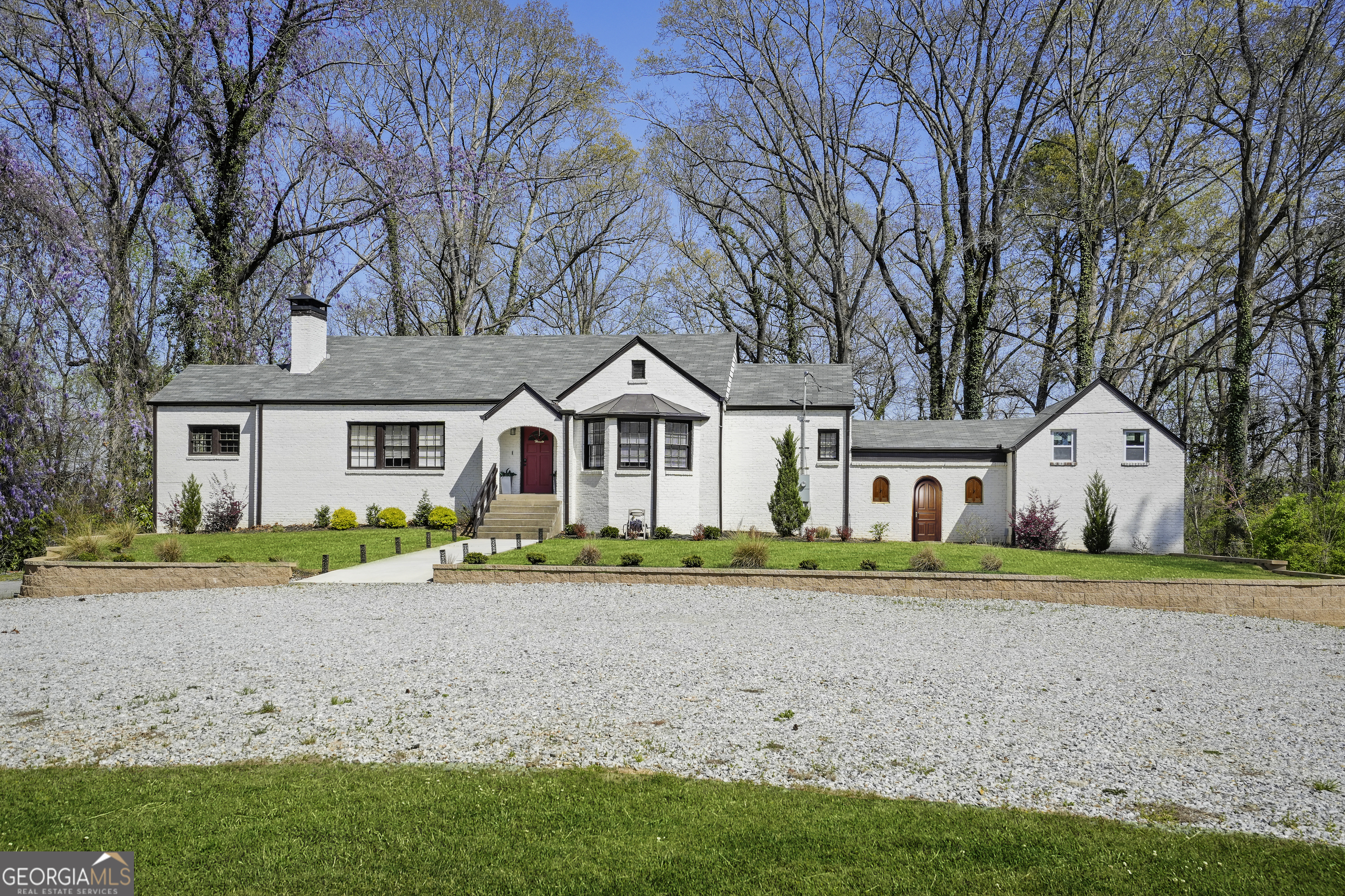 PRICED NEARLY HALF OFF APPRAISED VALUE! Gated 3,000+ sq. ft. home on almost 7 acres with a flexible Carriage House completely ideal for a guest suite or creative studio. Features include a spa-inspired European primary bath, oversized walk-in closet, unfinished attic + partial basement for expansion, and updated systems with a new vapor barrier & insultation. Just 15 minutes to the airport and under 30 to Downtown Atlanta. A rare opportunity that wont last long