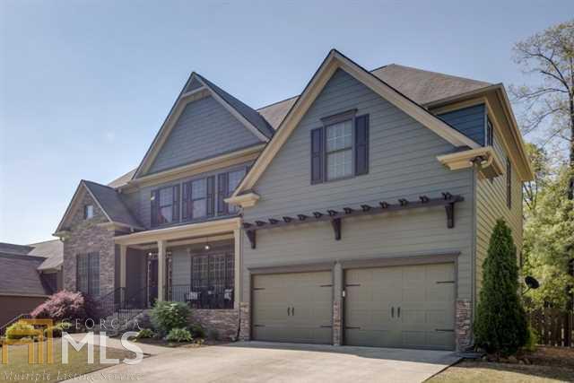 Exquisite Craftsman style custom home in the gorgeous Towne Mill subdivision adjacent to the beautiful Hickory Log Reservoir where you can fish and soak in the views! Wonderfully appointed home with garage pergola,extensive stone facade,fenced backyard with relaxing waterfall Koi pond that backs up to wooded privacy. Beautiful real hardwoods on entire main level.Crown moulding throughout,French door ofc on main, wrought iron spindles,granite counters,gigantic master bedrm w/sitting rm! Amazing amenities!!