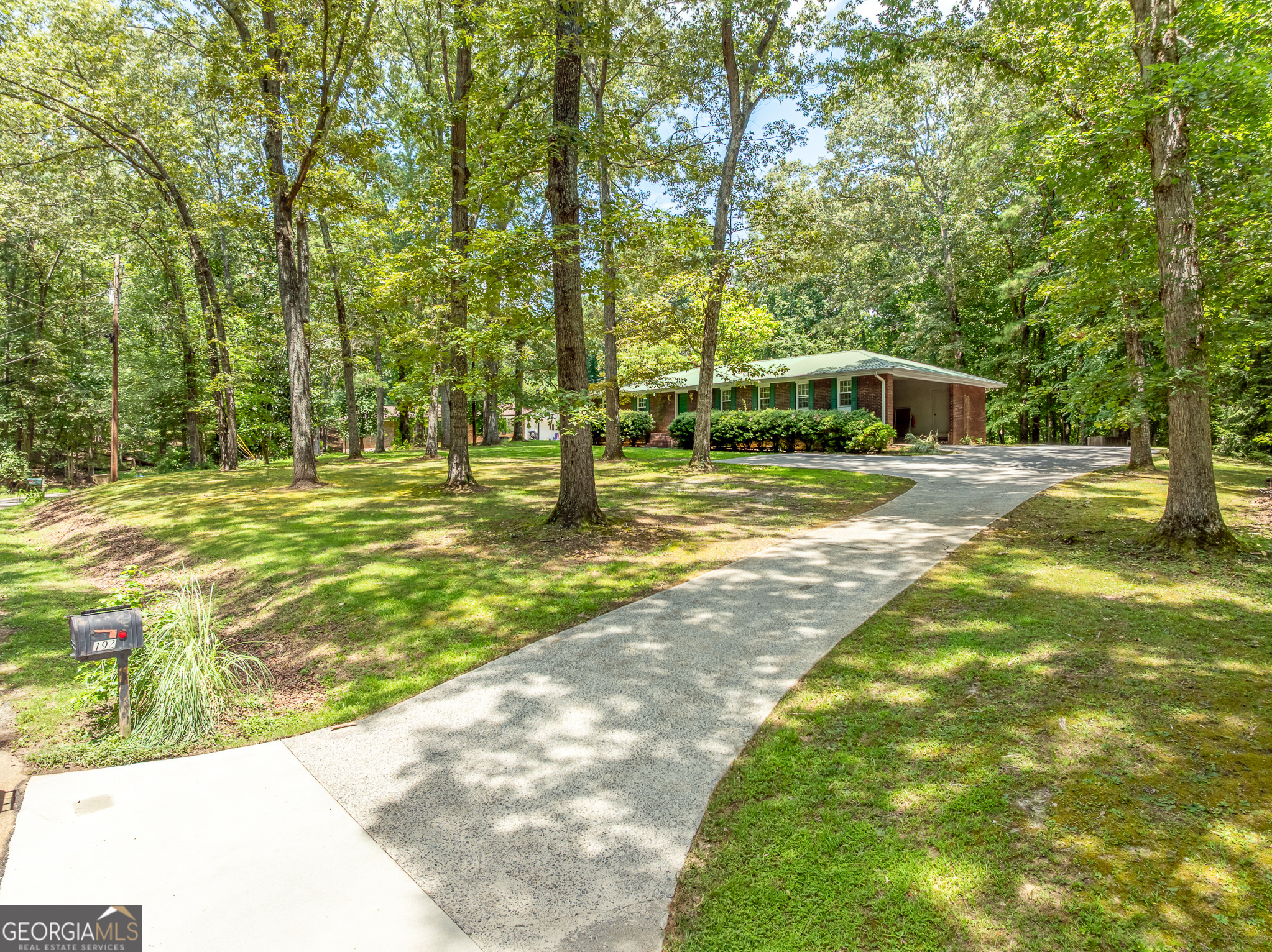 SIMPLY PEACEFUL! Imagine being minutes from docking your boat and living the good life. The 1960's Brick Ranch was built when homes were simply built well. The colors can change, the flooring can be updated but the structure and craftsmanship are with you forever. It is exciting to see what can be done to freshen up this awesome home. The property features almost 2.75 acres and the opportunity to live in a very private setting. Bring your imagination and take great bones and add your own design ideas to create your forever home. Family room, kitchen and living room could be converted to one awesome living space. Working from home? Transform one of the 2 outbuildings into your home office. Lake Allatoona and 575 are minutes away. Storage space for RV or boat would be super simple with this great property. The location, land and home each offer a unique look at how can you take "yesterday" and turn it into your tomorrow. Professional photos coming soon.