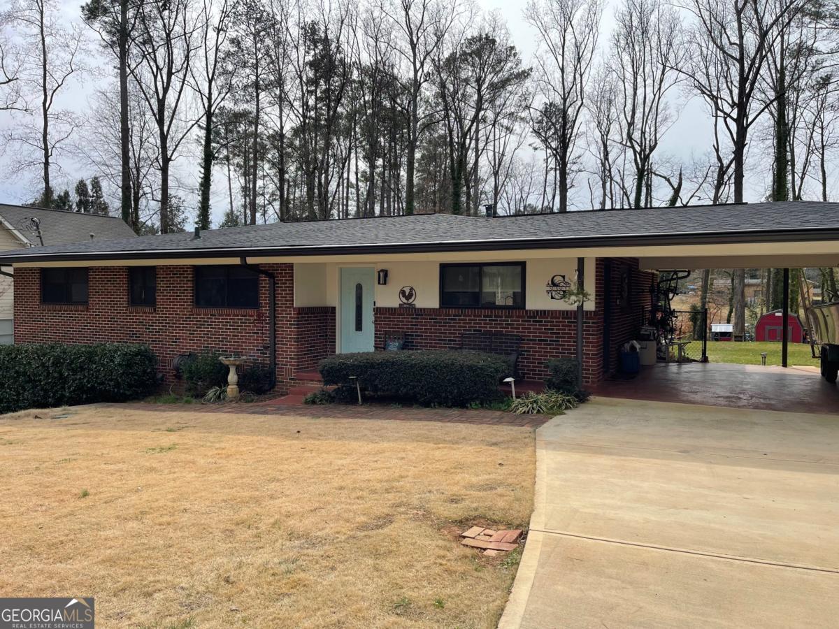 Incredible rental opportunity in Historic College Park! This 3/2 ranch has been fully renovated and sits on a stunning .9 acre lot. Your monthly rent includes lawn care and utilities! Covered parking. Hardwoods throughout. Close to Woodward Academy, Barrett Park, MARTA, golf, restaurants, and grocery store. Minutes from downtown Atlanta, Delta, Porsche, Tyler Perry Studios, ATL airport, and more! Credit, criminal, and rental history checks required. $60 per person application fee. One year lease. Managed by private owner, who will retain use of basement apartment and drive under garage. Shown by appointment only.