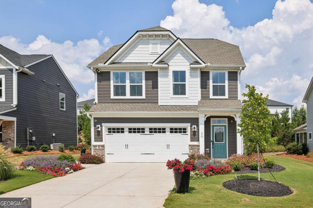 Better than new! This never-lived-in Ryan Homes Ferncliff model is now available in the highly sought-after Twin Lakes community-offering the perfect blend of modern design, quality construction, and resort-style living without the wait of new construction. This beautifully designed 3-bedroom, 2.5-bath home features an open-concept main level with a spacious family room and a stunning kitchen, complete with an oversized island, sleek 42" cabinets, and GE stainless steel appliances. The refrigerator, washer, and dryer are all included, making this truly move-in ready. Stylish luxury vinyl flooring runs throughout the main level, bathrooms, and laundry room, adding both elegance and durability. Upstairs, you'll find comfortable bedrooms and well-appointed bathrooms, ideal for families, professionals, or those looking to enjoy the low-maintenance lifestyle of a brand-new home. As a resident of Twin Lakes, you'll enjoy an unbeatable list of resort-style amenities, including two community pools with a splash pad, a clubhouse with an open-air pavilion and fully equipped fitness center, scenic nature trails for walking or jogging, a playground, two dog parks, and access to two beautiful lakes for fishing, canoeing, or kayaking. Located just 2.5 miles from I-85, Twin Lakes offers unmatched convenience for commuting or weekend adventures. You're less than five miles from local shopping at Publix, Kroger Marketplace, and Joy Company Market, and just minutes from charming downtown Hoschton and Braselton, known for their dining, shopping, and small-town charm. Enjoy world-class wine tasting at Chateau Elan Winery & Resort just 10 minutes away, take a short 20-minute drive to the Mall of Georgia, or head to Downtown Atlanta, only 35 miles from your doorstep. This is a rare opportunity to own a model home with premium upgrades in one of the area's fastest-growing and most desirable communities. Schedule your showing today!