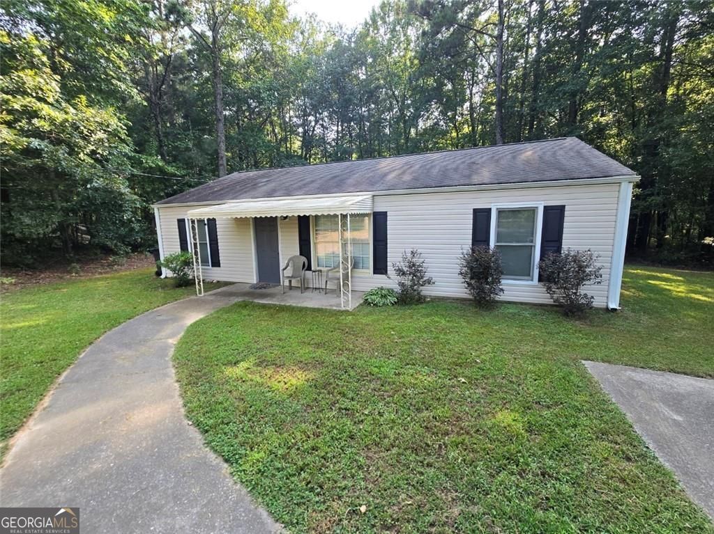 Charming Starter Home or Investment Opportunity! This 3 bedroom, 2 bath home offers 1,118 sq ft of comfortable living space with a desirable split-bedroom layout. Sitting on a spacious half-acre lot, there's plenty of room to enjoy outdoor living, gardening, or simply relaxing with no HOA restrictions. Whether you're searching for your first home or a solid rental property, this home checks all the boxes. Don't miss this opportunity to own a move-in ready property with great potential!