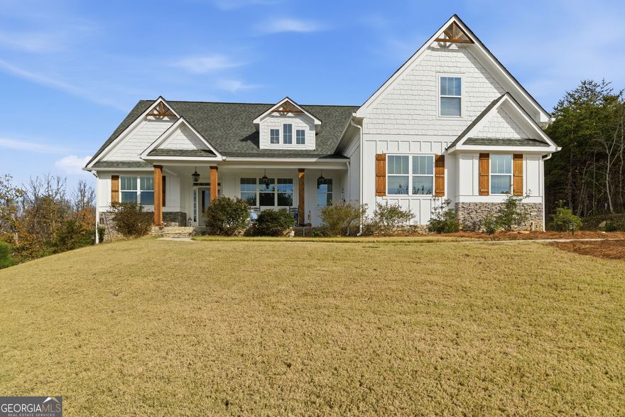 Welcome home to 760 Stoneledge Road - where breathtaking views meet refined mountain living. Nestled on a private 3-acre lot inside the prestigious gated Stoneledge community, this custom 5-bedroom, 4.5-bath modern farmhouse is a rare blend of elegance, comfort, and privacy.   Meticulously maintained, this home truly shows like new. From the moment you walk through the front door, you'll be greeted by soaring ceilings, an open-concept layout, and natural light that pours through every window - framing those unforgettable long-range mountain views. The heart of the home is the gourmet kitchen - a bright, thoughtfully designed space with stone countertops, stainless steel appliances, abundant cabinetry, and a spacious island that's perfect for gathering with family or friends. The kitchen flows seamlessly into the dining and living areas, making this home ideal for entertaining or cozy nights in. The main-level split-bedroom layout offers both privacy and convenience, with three spacious bedrooms and two and a half baths thoughtfully placed for comfort. The primary suite is your personal sanctuary - featuring dual walk-in closets, double vanities, a spa-inspired soaking tub, and a luxurious walk-in shower that feels like a five-star retreat. Upstairs, a private guest suite with full bath offers the perfect setup for visitors or a dedicated home office. The terrace level expands your living possibilities with a game room, kitchenette, large living area, additional bedroom with a full ensuite bath, storm room, and ample unfinished storage. It's an entertainer's dream, a family hangout, or even the ideal in-law suite - the possibilities are endless. Step outside and you'll find yourself surrounded by peace, privacy, and panoramic mountain beauty. Enjoy your morning coffee while the mist lifts off the Blue Ridge Mountains, or gather around for evening sunsets that paint the sky in color. Professional pictures coming soon