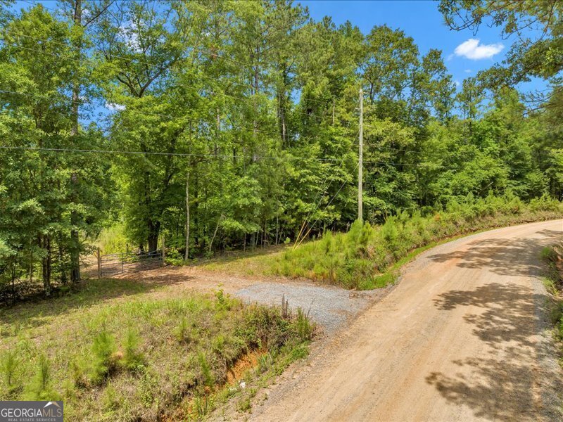 Featuring +/- 78.46-Acres in Jones County, GA with a 3.5-Acre pond.  The property is located in a rural area yet only 8-miles to Macon.  This is a great hunting tract with many different species of mature hardwoods, clearings for food plots and a good road system to get around.  There are many options for this property; from future development or choosing one of the many home sites to build a house and create a beautiful farm.  3.5-Acre Creek Fed Fishing Pond  Excellent Wildlife Population, Hunting Tract  Multiple Building Sites  Future Development Potential  Electricity, Gas and County Water Available  Located (8-Miles) to Macon, (11-Miles) to Gray and (90-Miles) to Atlanta  All of the following are included with a full price offer:  2010 45hp Mahindra 4x4 tractor with front end loader.  Attachements include:  6' bushhog  box blade  harrow  2 trough Feeders  5 Deer Stands  1 tripod  1 tower stand  1 lockon with climbing sticks  2 lean-to stands  10 - 55 Gallon metal drums for feed/ corn storage  Call Land Agent Daron Woodham for more information and showing instructions at 706-207-3768.
