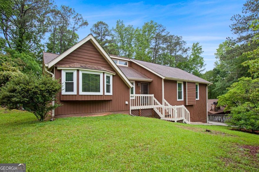 Located just minutes from Blackwell Rd and Ebenezer Rd in Marietta, GA, this spacious home offers a well-designed layout with both comfort and functionality. The main level features well-maintained wood floors, a bright fireside living room with soaring ceilings and recessed lighting, a separate dining room, and an eat-in kitchen with stained cabinets, granite countertops, stainless steel appliances, recessed lighting, track lighting over the sink, and a cozy breakfast nook. You'll find three bedrooms and two full bathrooms on the main level, including the primary ensuite with a double vanity, tub/shower combo, and a walk-in closet. The finished basement provides excellent additional living space, and a recreation roomCoperfect for guests, hobbies, or entertaining a full bathroom with heated floors. The 2-car garage is also conveniently located on the lower level. Just off the living room, step outside to a screened-in covered porch that offers a peaceful space to relax and enjoy the outdoors. Discounted rate options and no lender fee future refinancing may be available for qualified buyers of this home